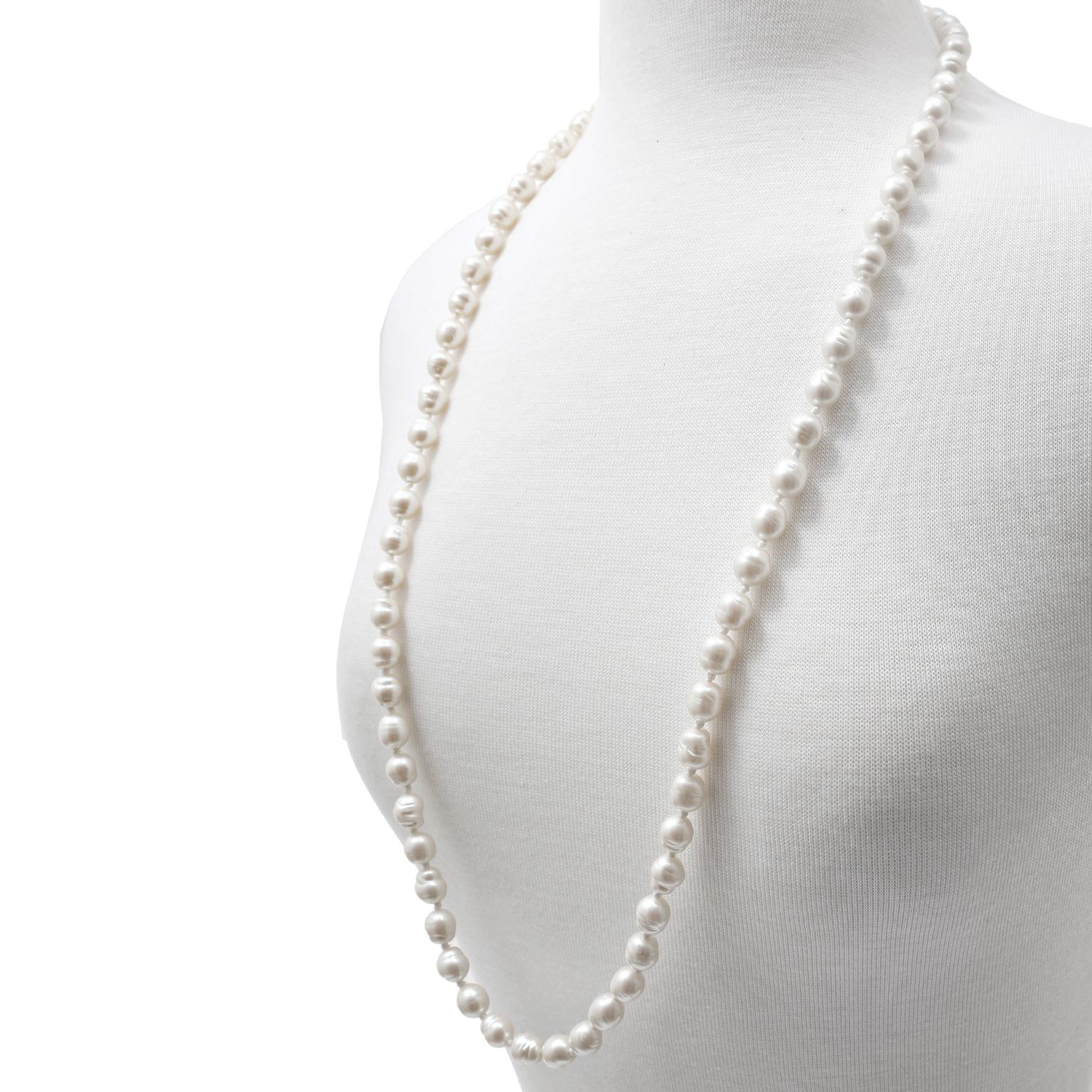 This authentic Chanel White Baroque Pearl Necklace is in excellent vintage condition.  Simple and classic with an elegant CC clasp, these faux pearls can accompany any outfit.  17