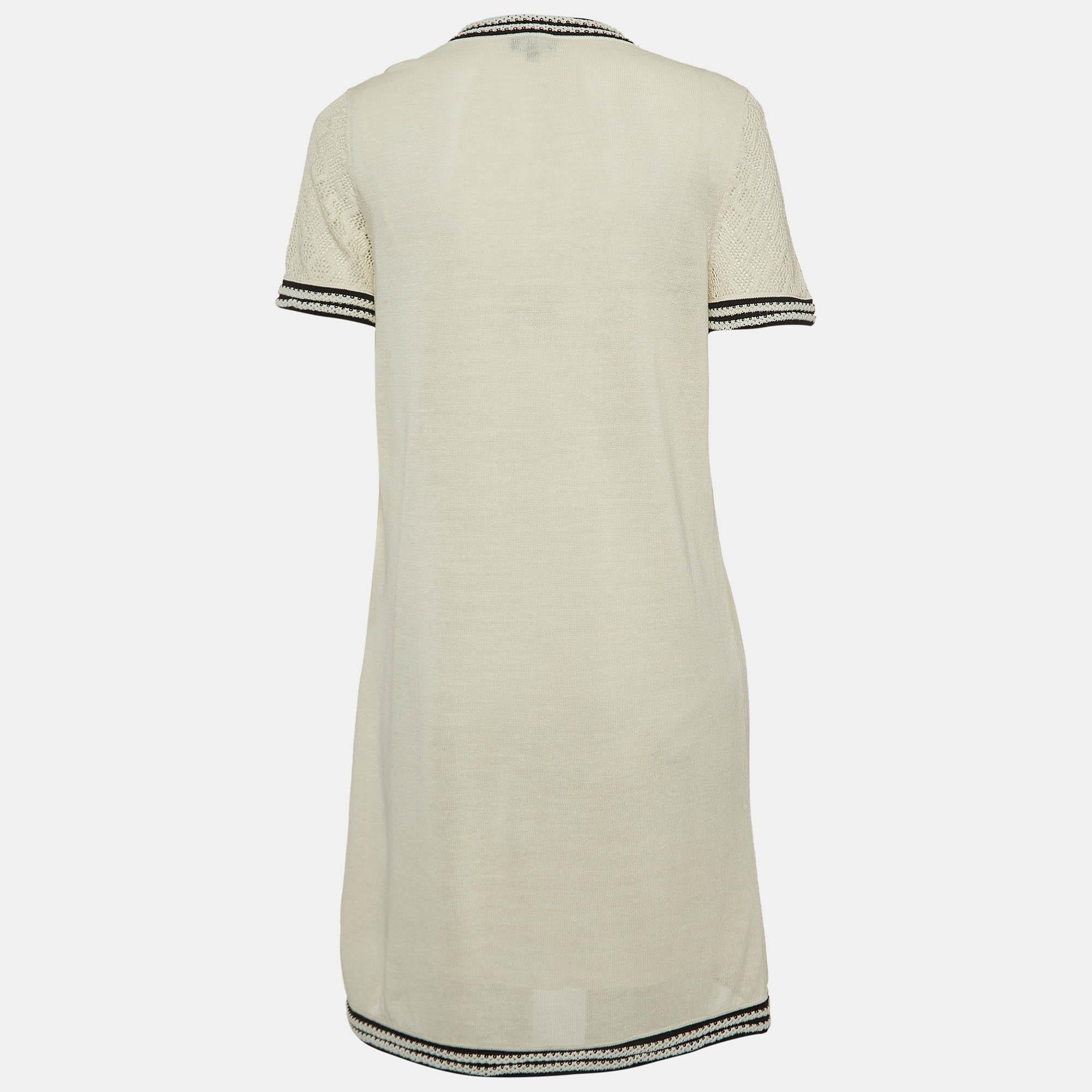 The Chanel dress is a chic blend of sophistication and playfulness. The dress features a monochromatic color scheme, a flattering mini length, and exquisite knit fabric. The addition of pockets adds a practical yet stylish touch, making it a