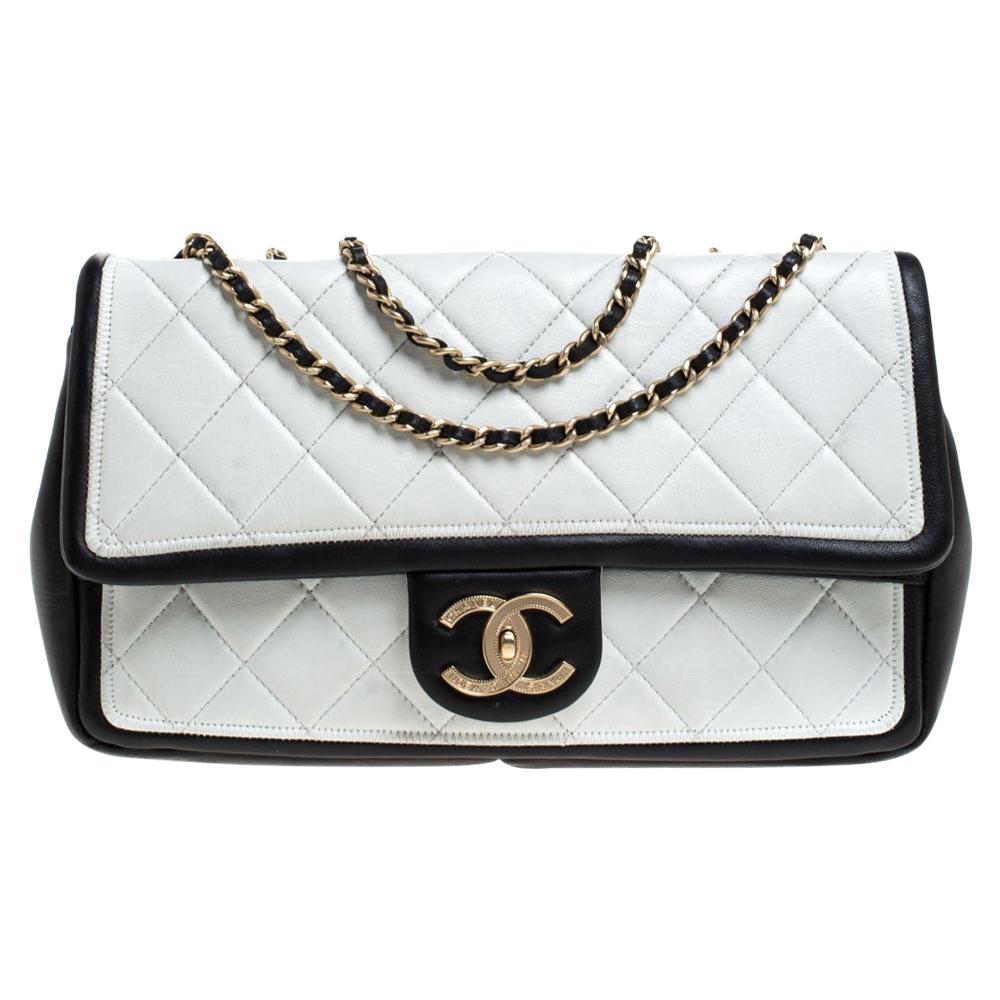 Chanel's flap bags are the most iconic handbags in the fashion world. Totally worth the splurge, these bags, that have become a symbol of class and luxury, carries unparalleled elegance and charm. This medium Graphic flap bag is crafted from leather