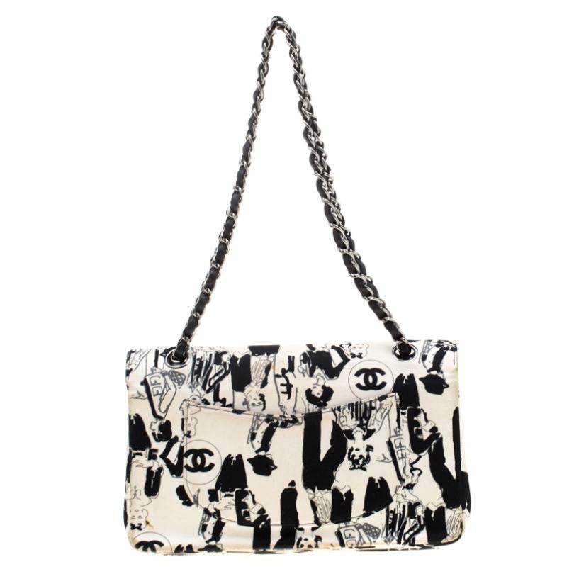 We are in absolute awe of this Classic Double Flap bag from Chanel as it is appealing in a surreal way. The Karl Lagerfeld Limited Edition bag is crafted from black and white sketch canvas. It has a chain and leather interwoven strap along with the
