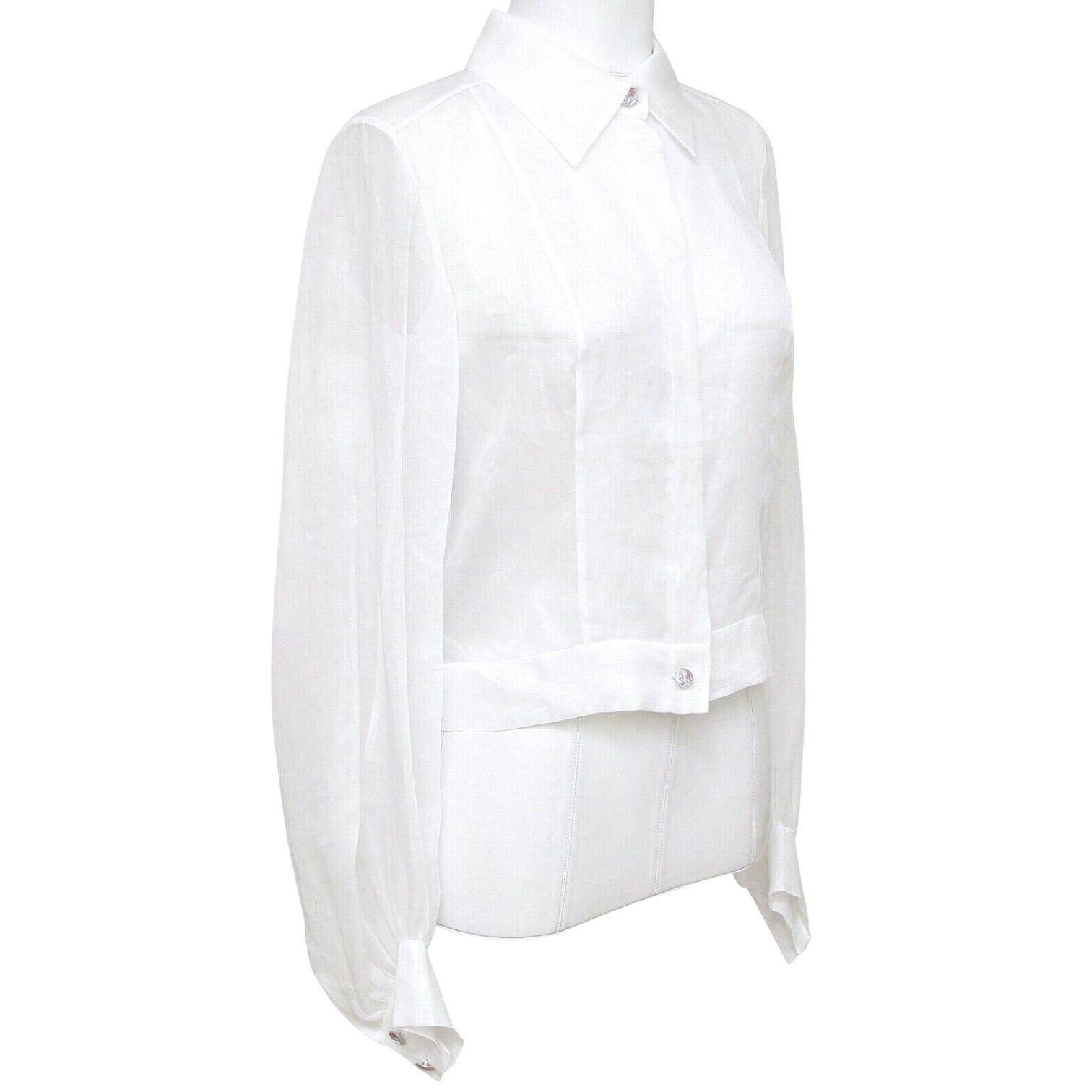 GUARANTEED AUTHENTIC CHANEL 2017 CRUISE WHITE COTTON BLOUSE W/TAGS

Design:
 - Long sleeve lightweight white blouse from the 2017 Collection.
 - Button down front.
 - Two buttons at each cuff.
 - Pointed collar.
 - Comes with attached tag and extra