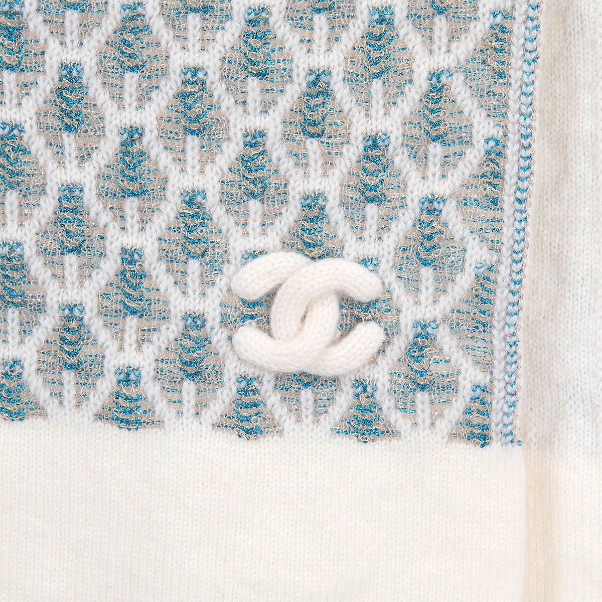 100% authentic Chanel CC shawl in off-white cashmere (94%), viscose (3%), cotton (1%), cupro (1%) and blue metallised fibre (1%). Has been worn once and is in excellent condition. 

Measurements
Width	43cm (16.8in)
Length	190cm (74.1in)

All our