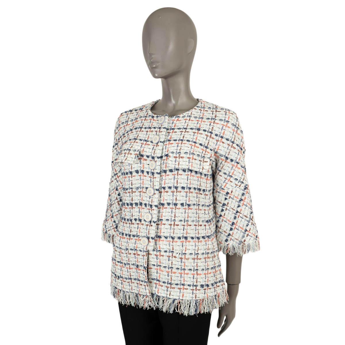 100% authentic Chanel collarless tweed jacket in white, blue, red and green cotton (35%), polyamide (28%), acrylic (26%) and linen (11%). Features fringe trims, 3/4 sleeves and two flap pocket at the chest. Opens with enamelled CC buttons on the