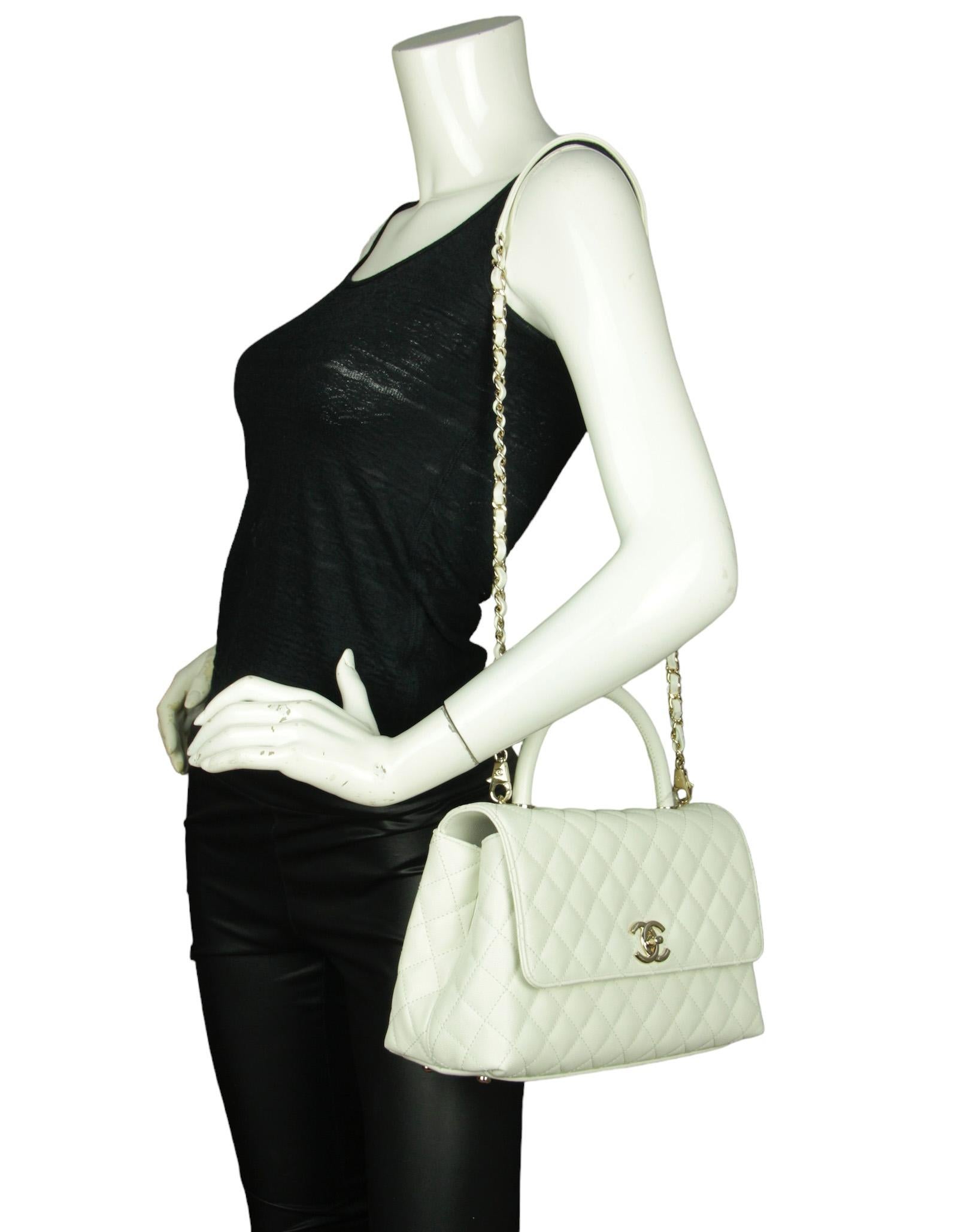 Chanel White Caviar Leather Quilted Small Coco Handle Flap Bag

Made In: Italy
Year of Production: 2023
Color: White
Hardware: Pale goldtone
Materials: Caviar leather
Lining: Leather
Closure/Opening: Flap top with CC twist lock
Exterior Pockets: