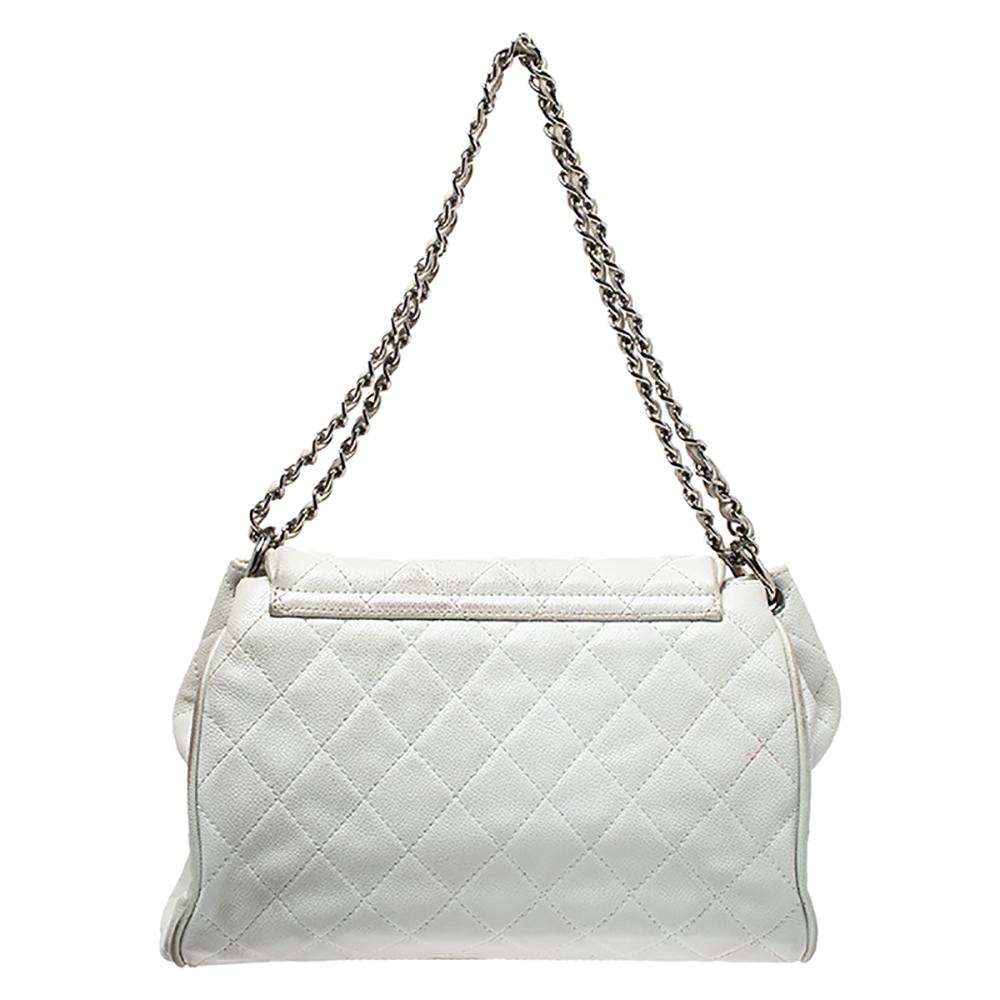 Chanel is known for crafted exquisite bags coveted by women around the world. This white accordion flap bag is a true classic. Crafted from durable quilted Caviar leather, the bag features two chain-link straps entwined with leather and a large CC