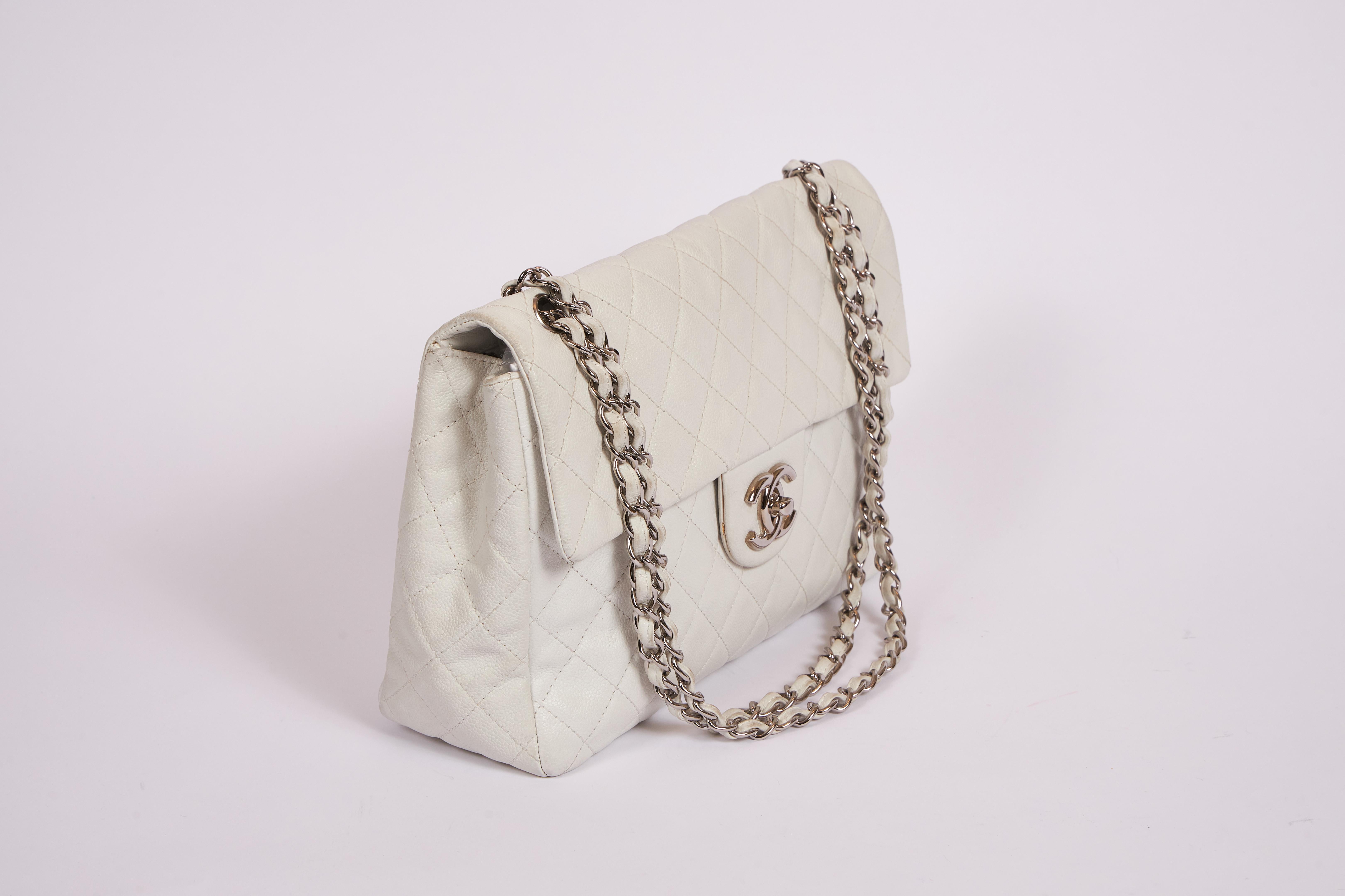Chanel white caviar may single flap. Silver tone hardware. Very good condition. Little mark shown in one of the photos. Shoulder drop 12