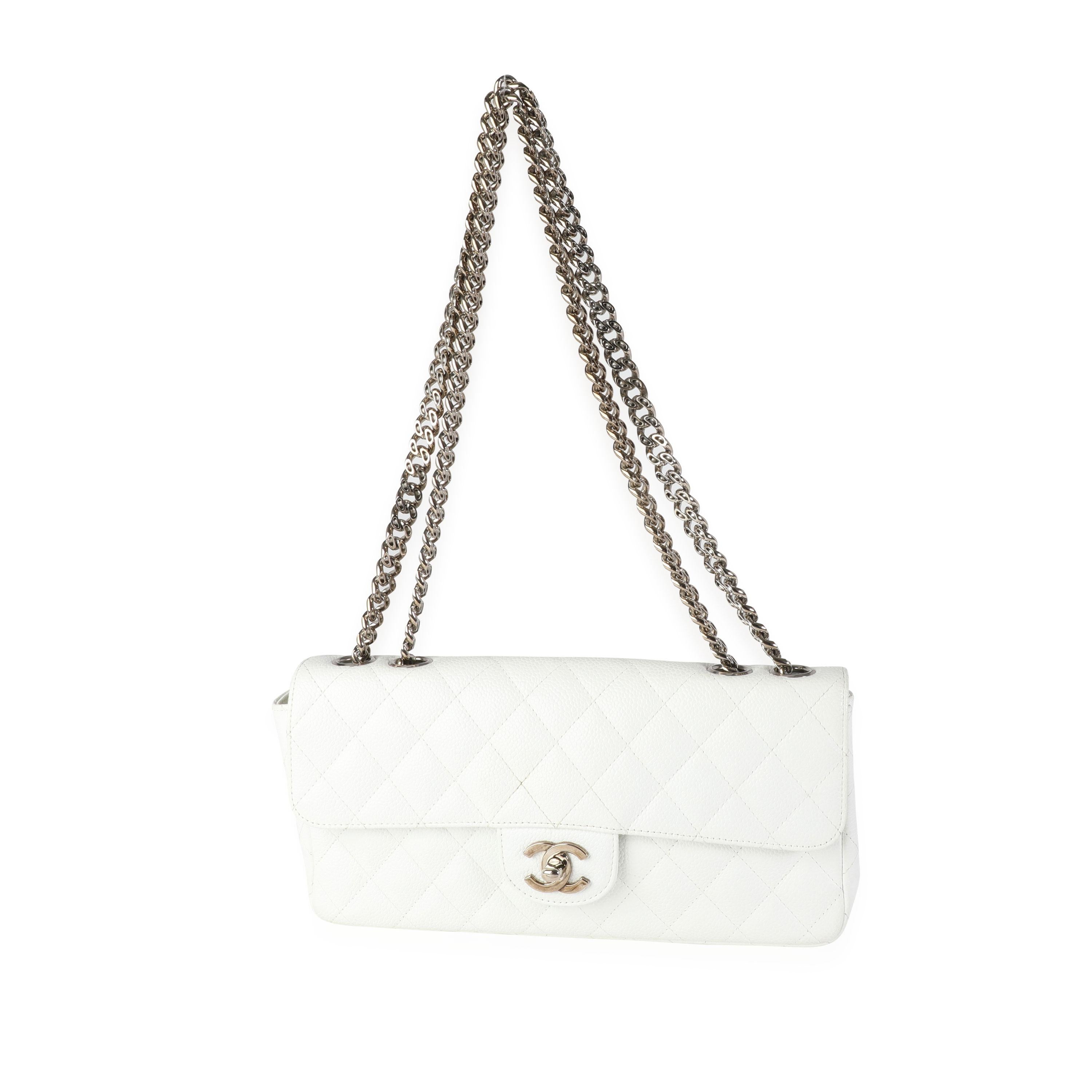 Listing Title: Chanel White Caviar Quilted East West Bijoux Single Flap Bag
SKU: 116254
Condition: Pre-owned (3000)
Handbag Condition: Very Good
Condition Comments: Very Good Condition. Scratching and tarnishing to hardware. Marks to interior due to