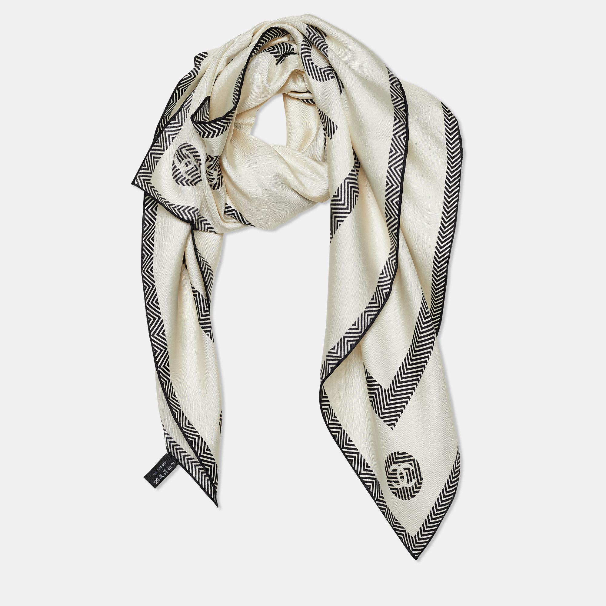 The perfect punctuation to your stylish look will be this Chanel scarf! It has been stitched using soft silk in a white shade and adorned with iconic CC logo prints all over. Wrap it around your neck to accessorize the chic way!

