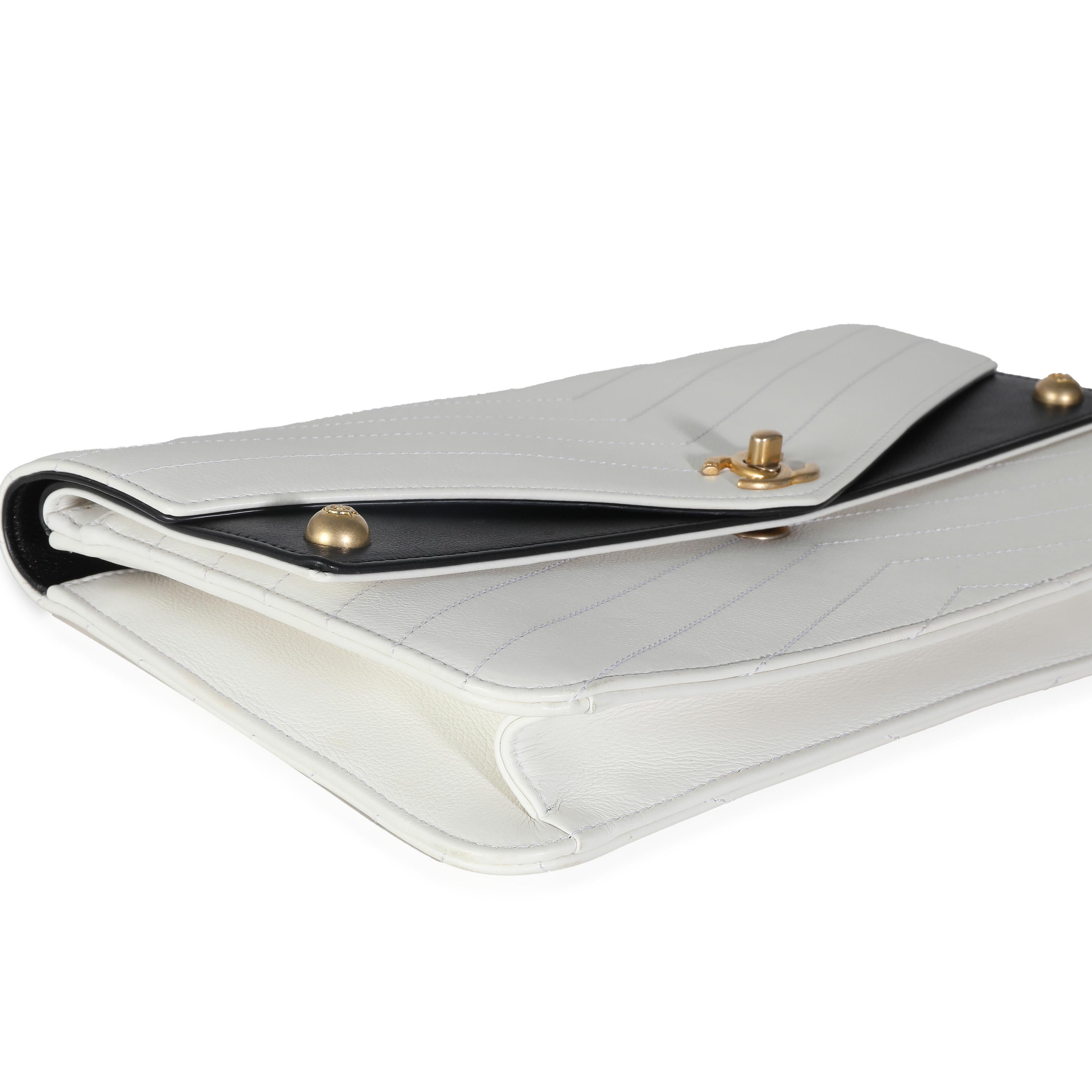 Listing Title: Chanel White Chevron Calfskin Casual Trip Flap Clutch
SKU: 139434
Condition: Pre-owned 
Condition Description: A timeless classic that never goes out of style, the flap bag from Chanel dates back to 1955 and has seen a number of