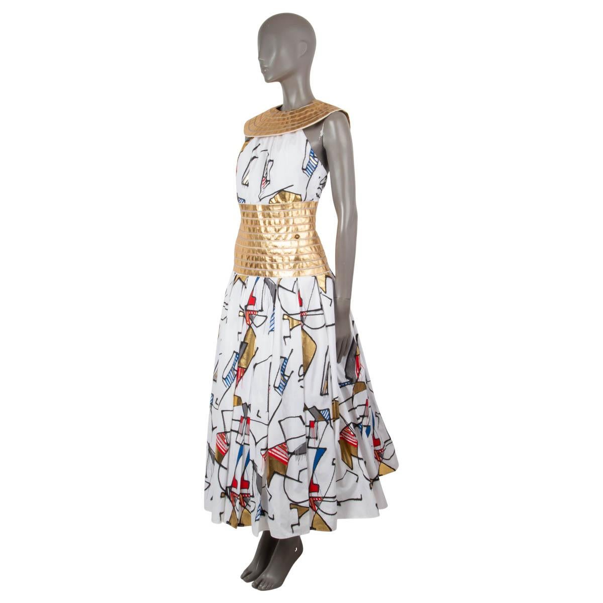 100% authentic Chanel flared and structured graffiti dress in white, gold, red, blue and black cotton (100%) and lined in white silk (100%). The design features a removable gold-tone paneled lambskin collar and waist part. There is a stiff peplum