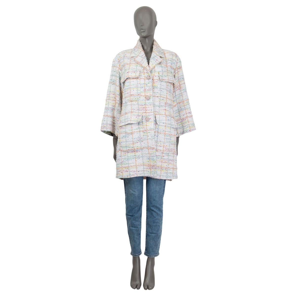 100% authentic Chanel 2019 oversized side-zip coat in white, yellow, blue, green, orange and pink cotton (52%), polyamide (44%), acrylic (3%) and viscose (1%) tweed. Jacket has three crystal and stone embellished buttons at front and four flap