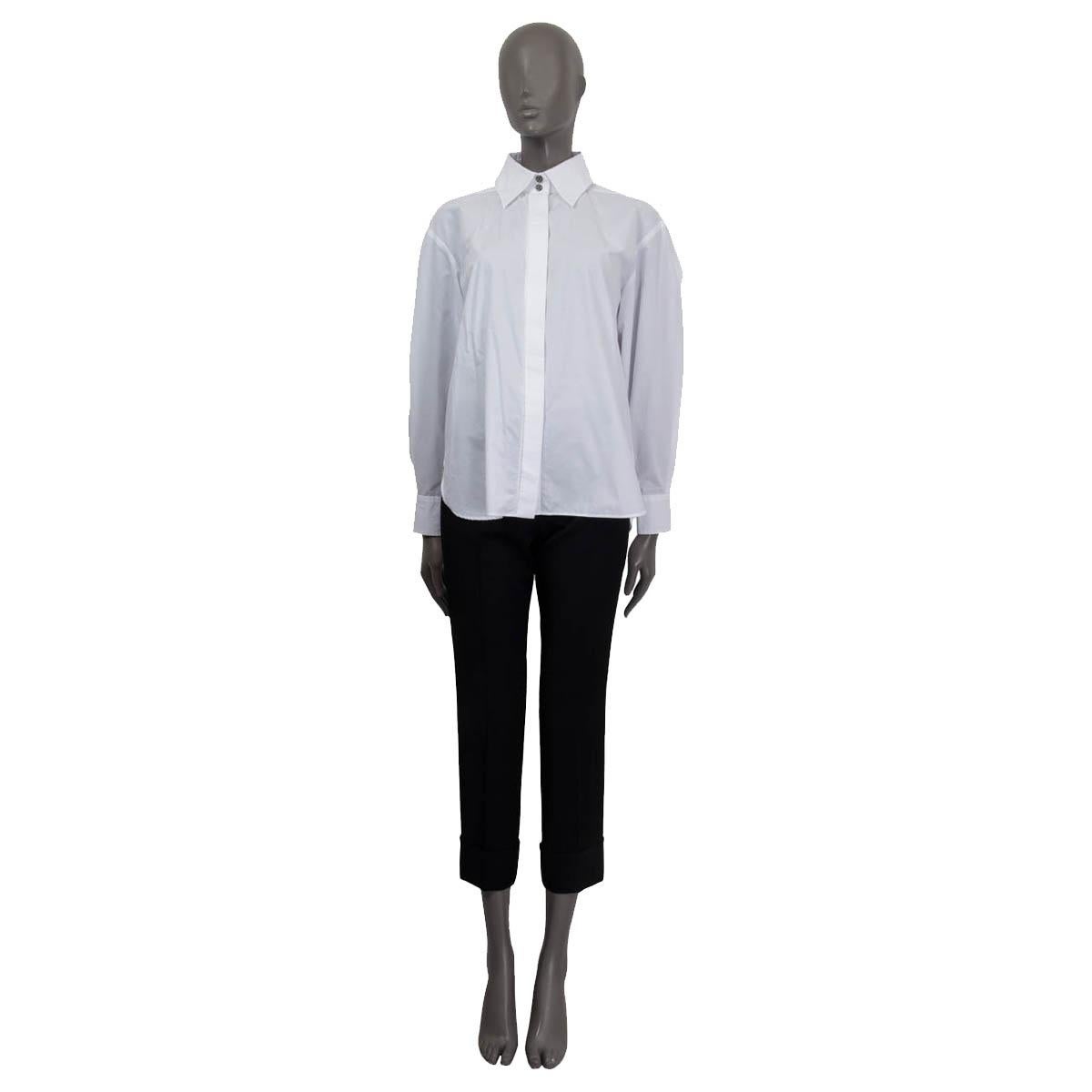 100% authentic Christian Dior sheer polka dot tunic shirt in white and black silk (assumed because tag is missing). Features batwings aChanel 2019 classic button-up shirt in white cotton (100%). Features an oversized look and 'CC' buttoned cuffs.