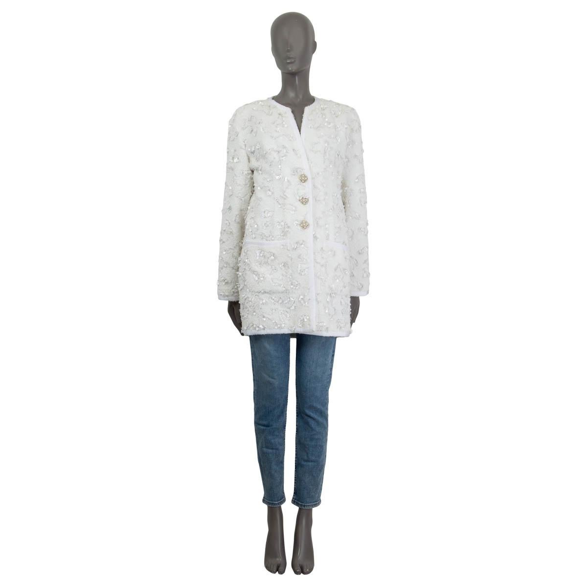 100% authentic Chanel 2019 Oversized Sequin Embellished Terry Cloth Jacket in off-white cotton (80%) and poyester (20%) featuring grosgrain trimming and two patch pockets at front. Jacket has three crystal and stone embellished buttons at front.