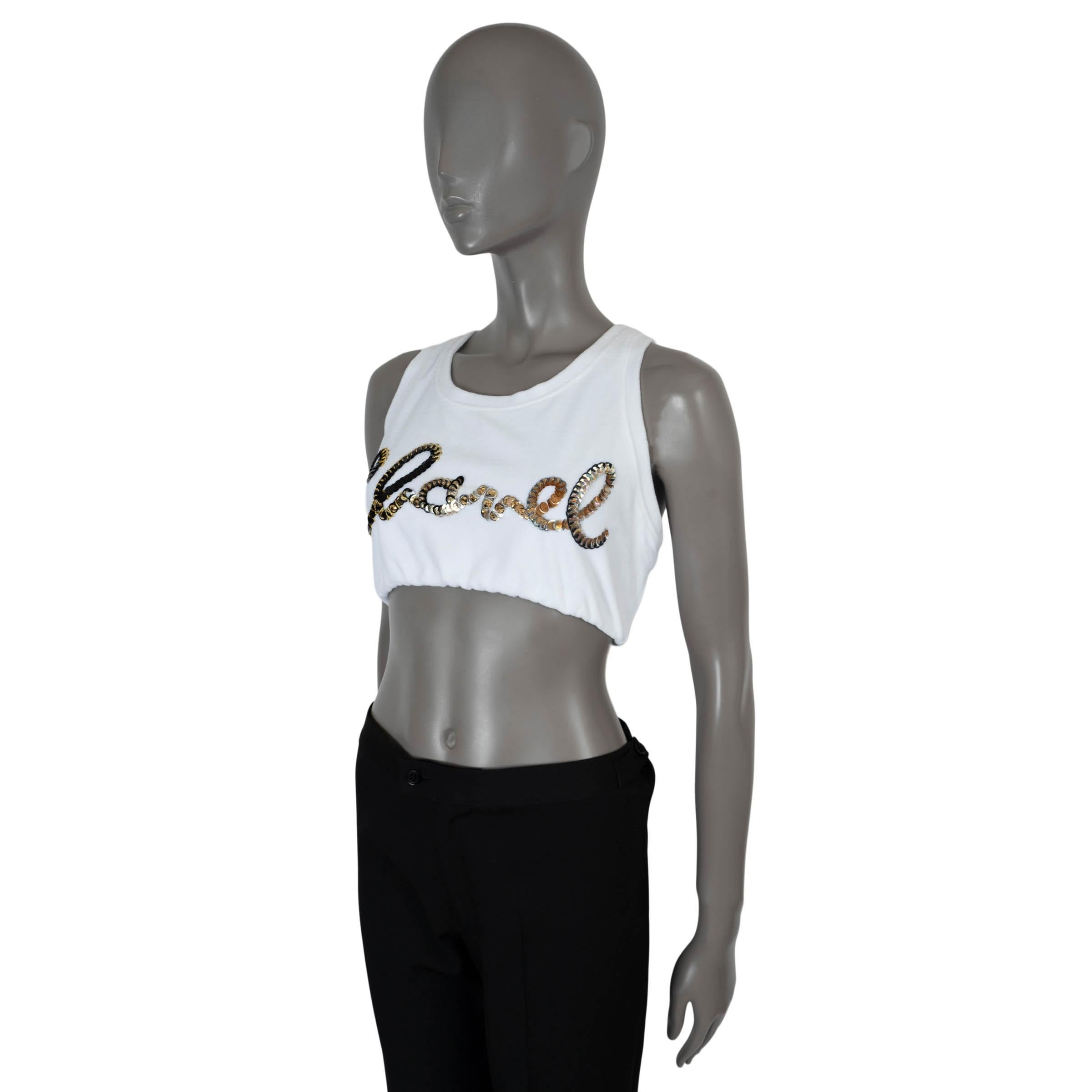 100% authentic Chanel logo thank top in white cotton (82%) and polyester (18%) embellished with black, gold and silver sequins. Unlined with an elastic waistband. Has been worn and is in excellent condition. 

2022 Spring/Summer

Measurements
Model