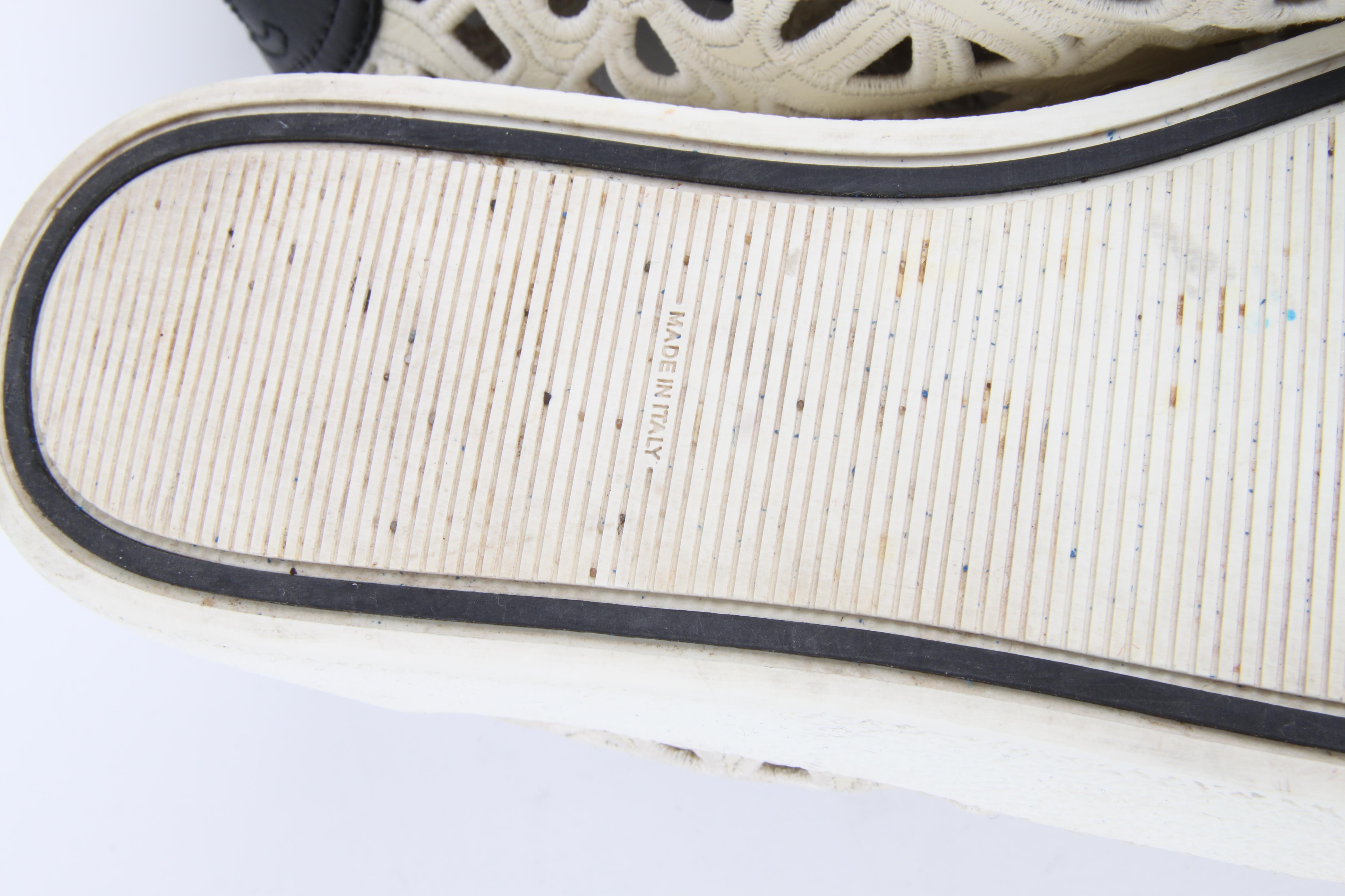 Chanel white cotton laser cut open-work CC logo and camelia low-top sneakers In Good Condition In Baarn, NL