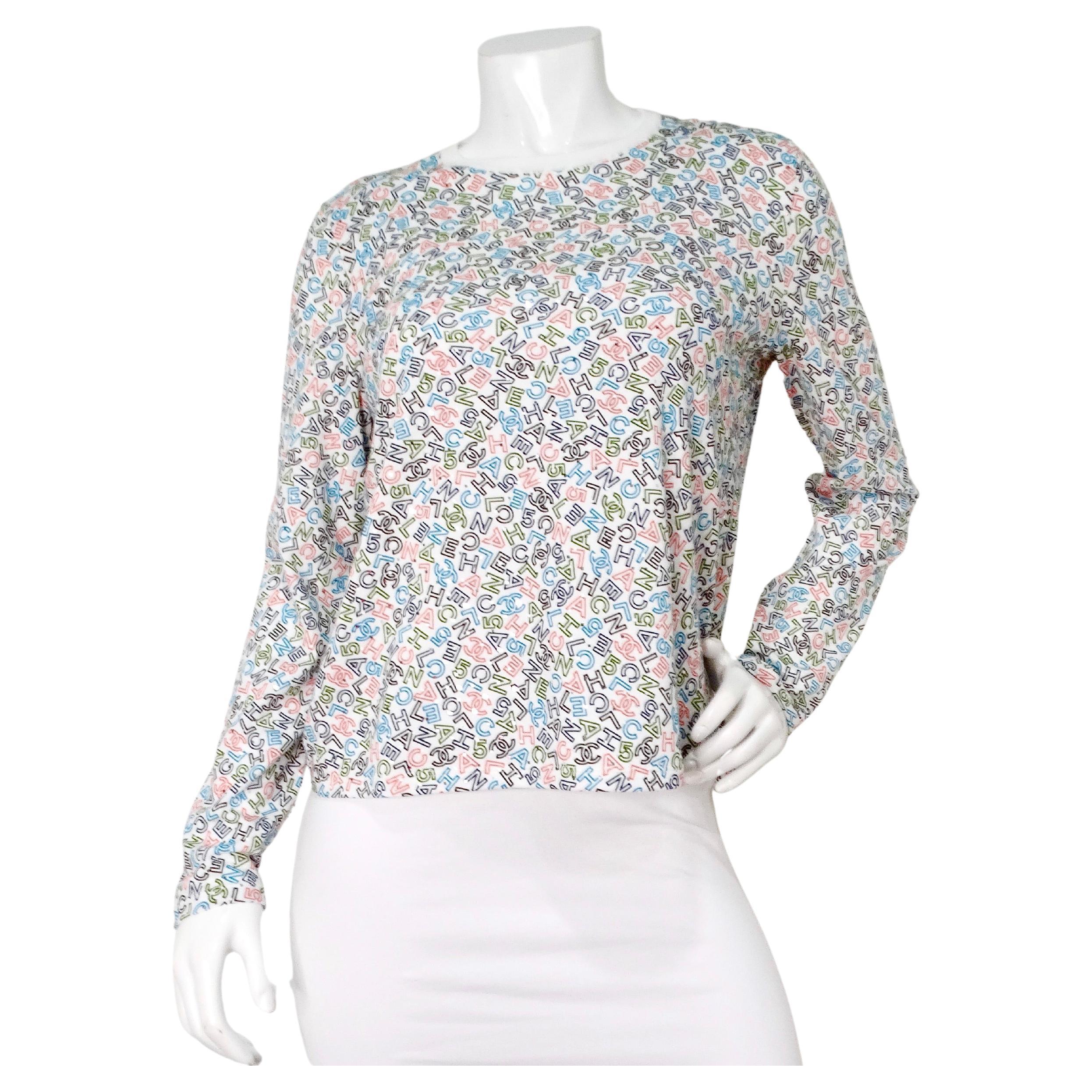 Top a manica lunga con paillettes in cotone bianco di Chanel in vendita
