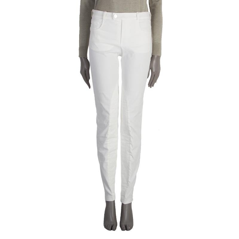 Pantalones de montar acolchados 100% auténticos Chanel de algodón marfil (63%), nailon (33%) y elastano (4%). Tres bolsillos delanteros y dos traseros. Se abre con cremallera oculta y botón en la parte delantera. Sin forro. Se han usado y están en
