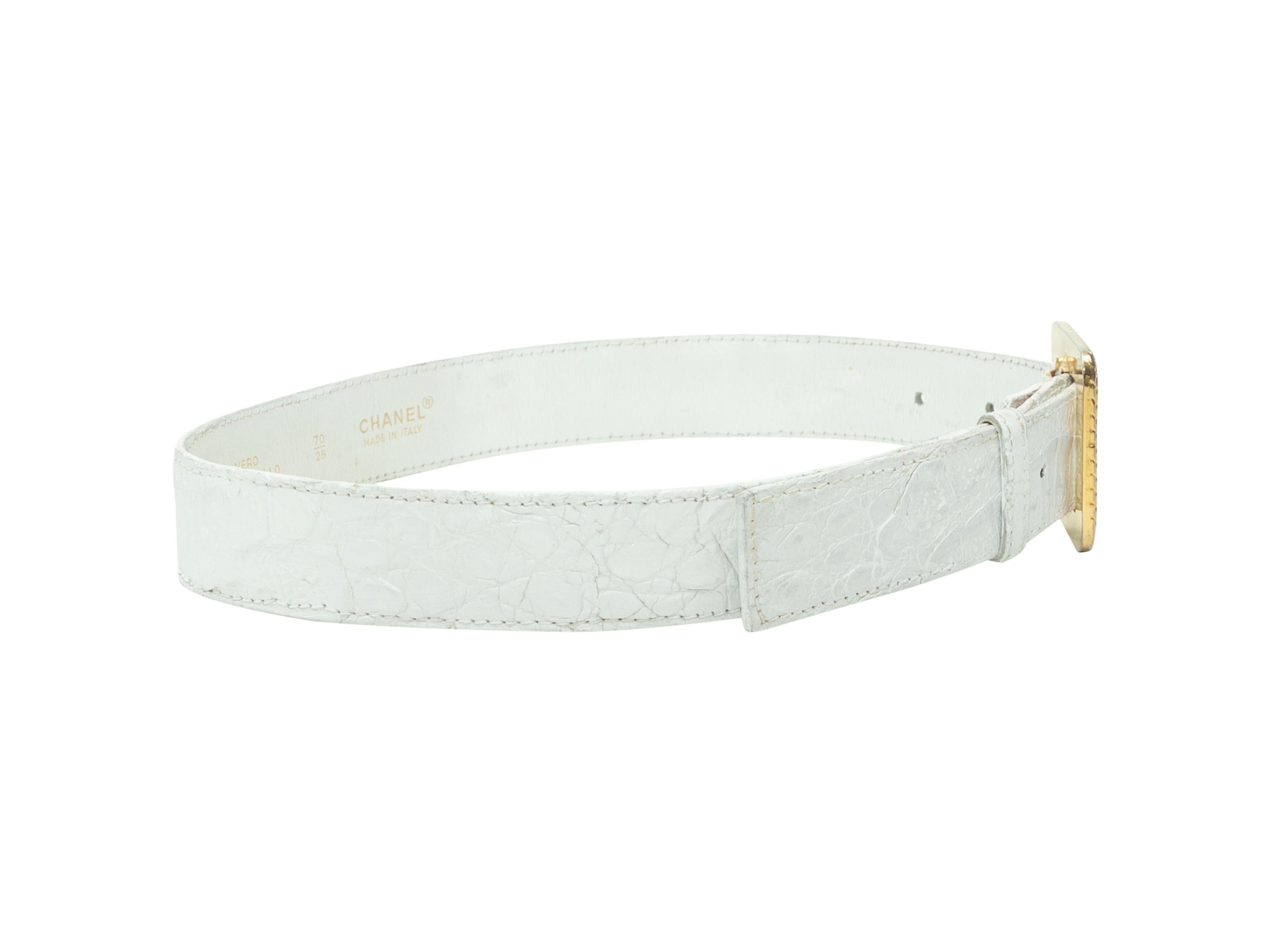 Product Details: White crocodile belt by Chanel. Oversize gold-tone buckle closure at front. Designer size 70/28. 1.5