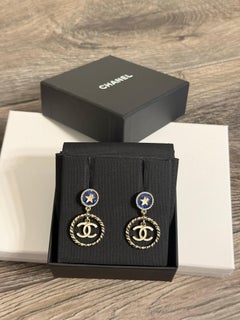 CHANEL White Enamel CC Blue Star Accent Gold Dangle Earrings