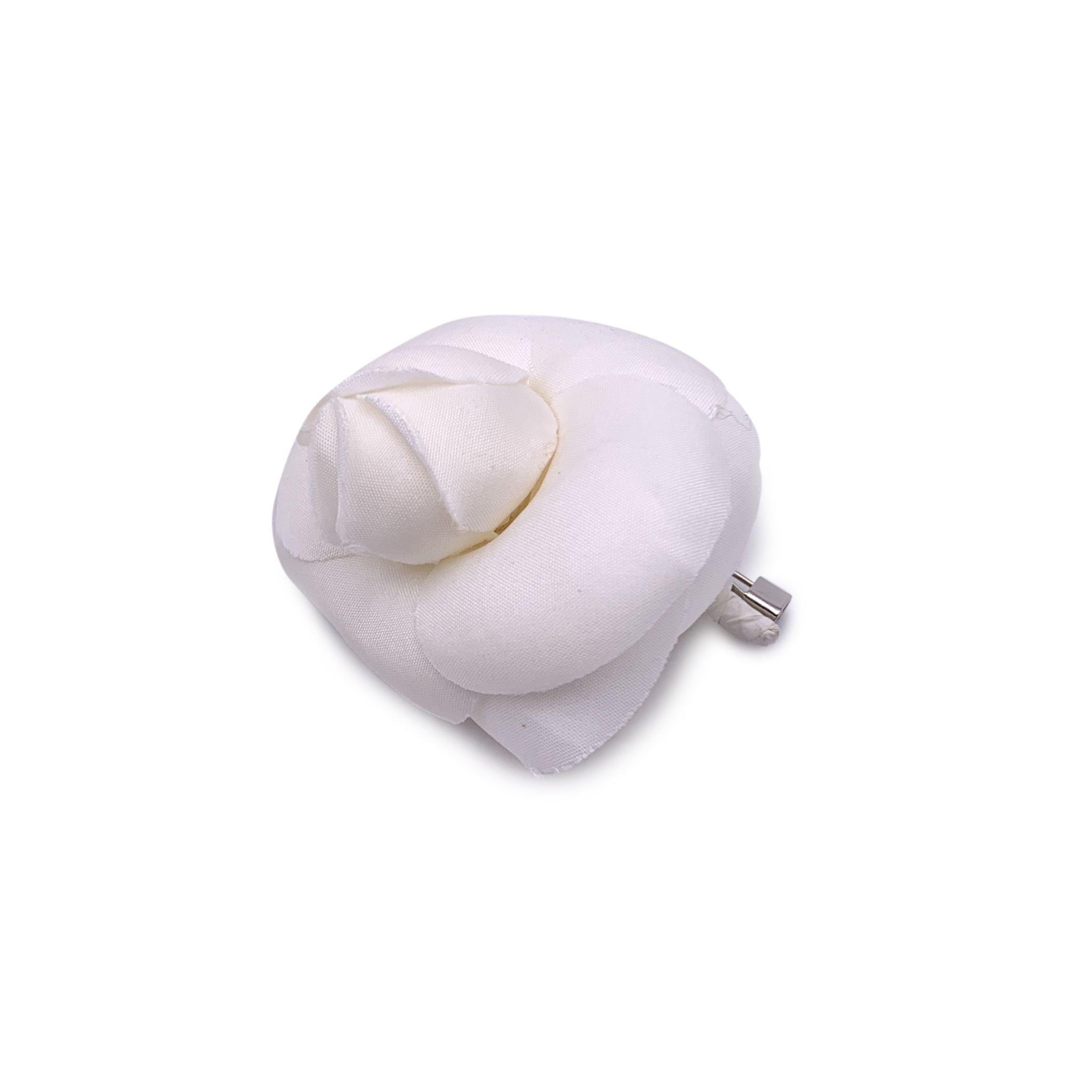 Chanel Vintage Camelia Camellia Flower Pin Brooch. White fabric petals. Safety pin closure. Max width: 2 inches - 5.1 cm. 'CHANEL - CC - Made in France' oval tab on the back Condition A - EXCELLENT Gently used. Please check the photos carefully and
