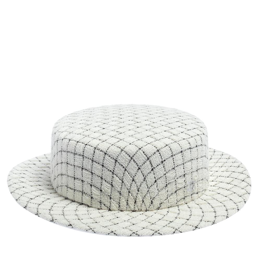 Chanel’s take on the timeless Boater hat is impeccable. The tweed hat in white has a checked design all over. The style goes well with your resort and holiday looks.

Includes: Original Box
