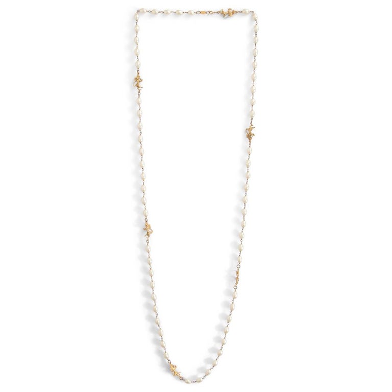 CHANEL white faux pearl and gold LION Necklace at 1stDibs