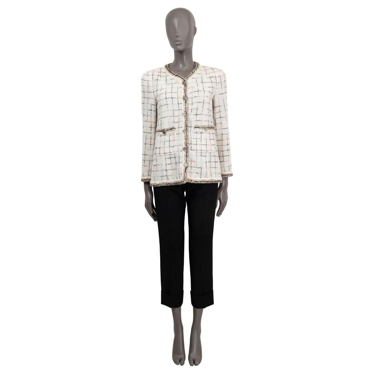 100% authentic Chanel check tweed jacket in white, gold, silver and black nylon (70%), wool (24%) and polyester (6%). Features two buttoned patch pockets on the front and buttoned cuffs. Opens with six silver-tone 'CC' buttons on the front. Lined in