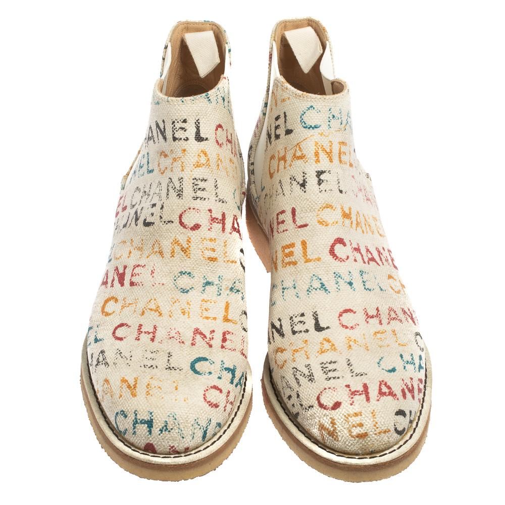 Celebrating the fusion of fine craftsmanship and luxury fashion, these Chanel Chelsea boots are absolutely worth the splurge. The white boots are crafted from graffiti logo printed canvas, detailed with elastic panels on the sides, and endowed with
