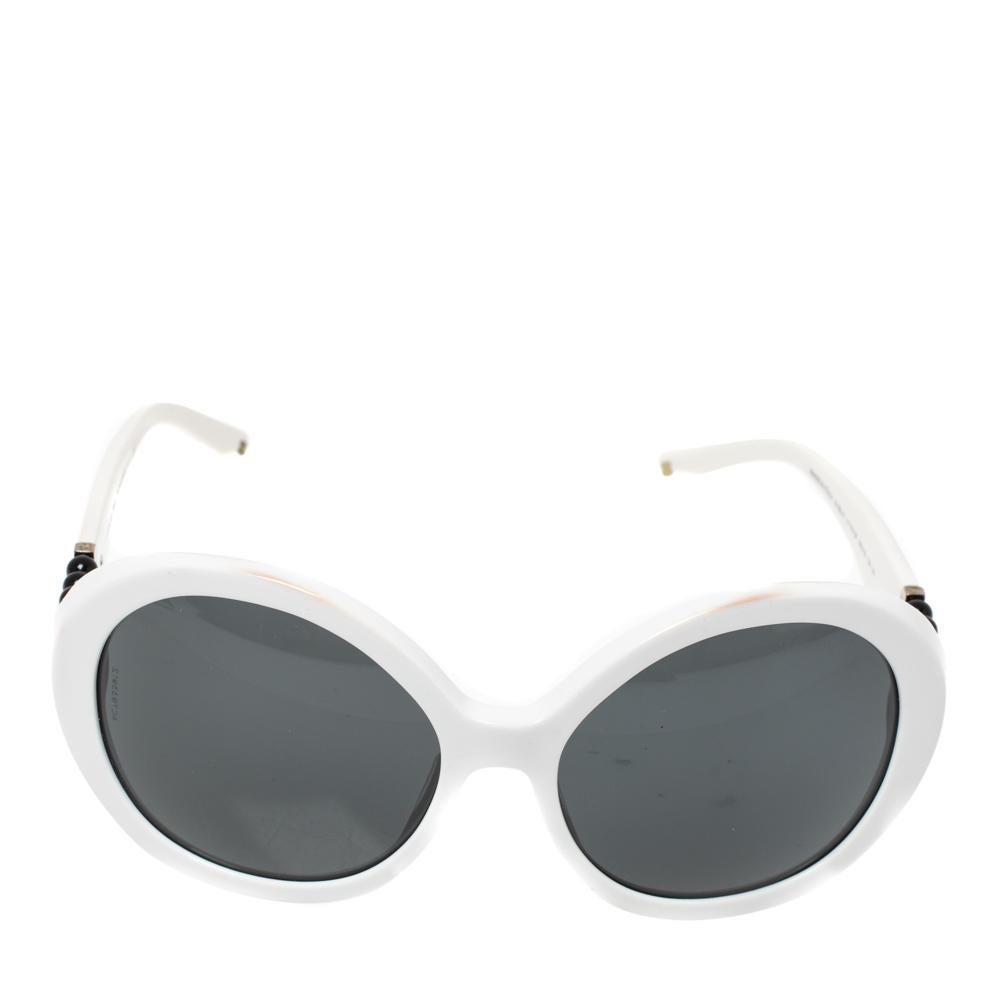 This elegant and opulent pair of round sunglasses by Chanel will surely assist you with a sumptuous look. Crafted from acetate, it features adorable round frames and black pearls embellishments along with labeled temples.

Includes:Info Booklet,