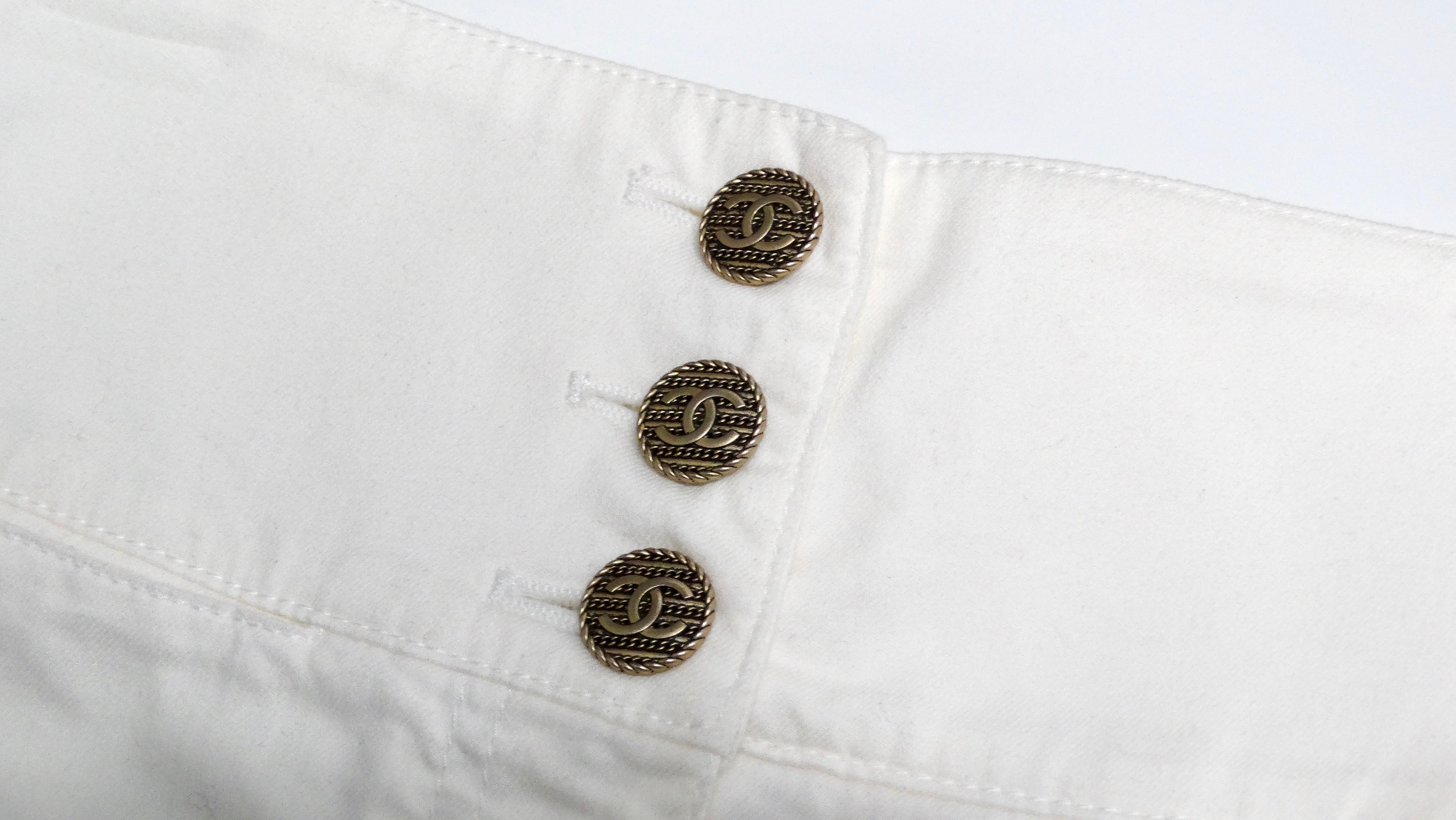 The Chanel White High-Waisted Cotton Stretch Denim Shorts are a quintessential summer staple that blend comfort and elegance seamlessly. Crafted from cotton stretch denim, these shorts feature a flattering high-waisted design that accentuates the
