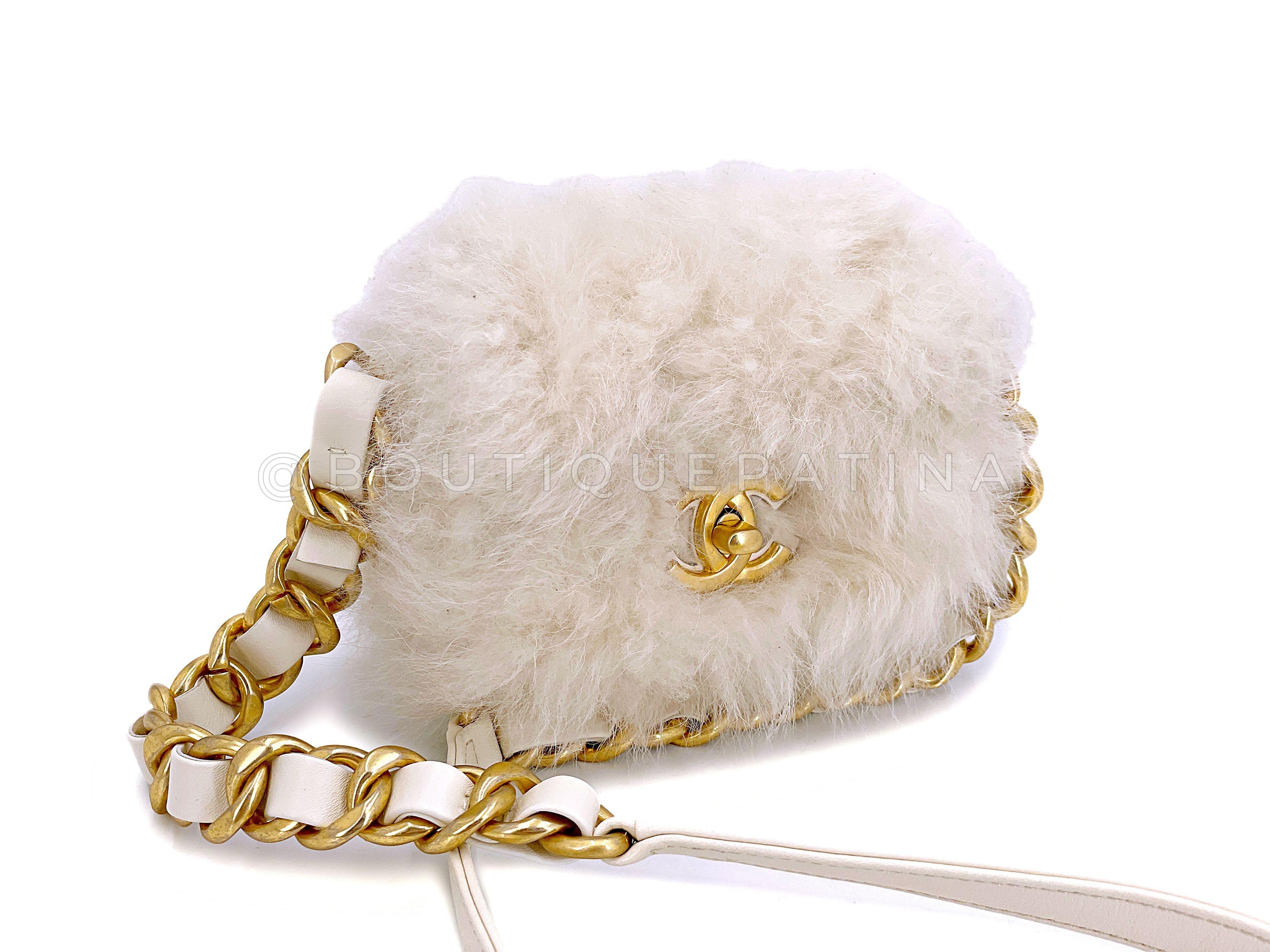 Store item: 67242

We love Chanel White Ivory Fur Mini Crossbody Flap Bag Chunky Chain  not only because it's chic and seasonal - but it's environmentally friendly with faux fur. The chunky woven chain strap in brushed gold hardware goes so well