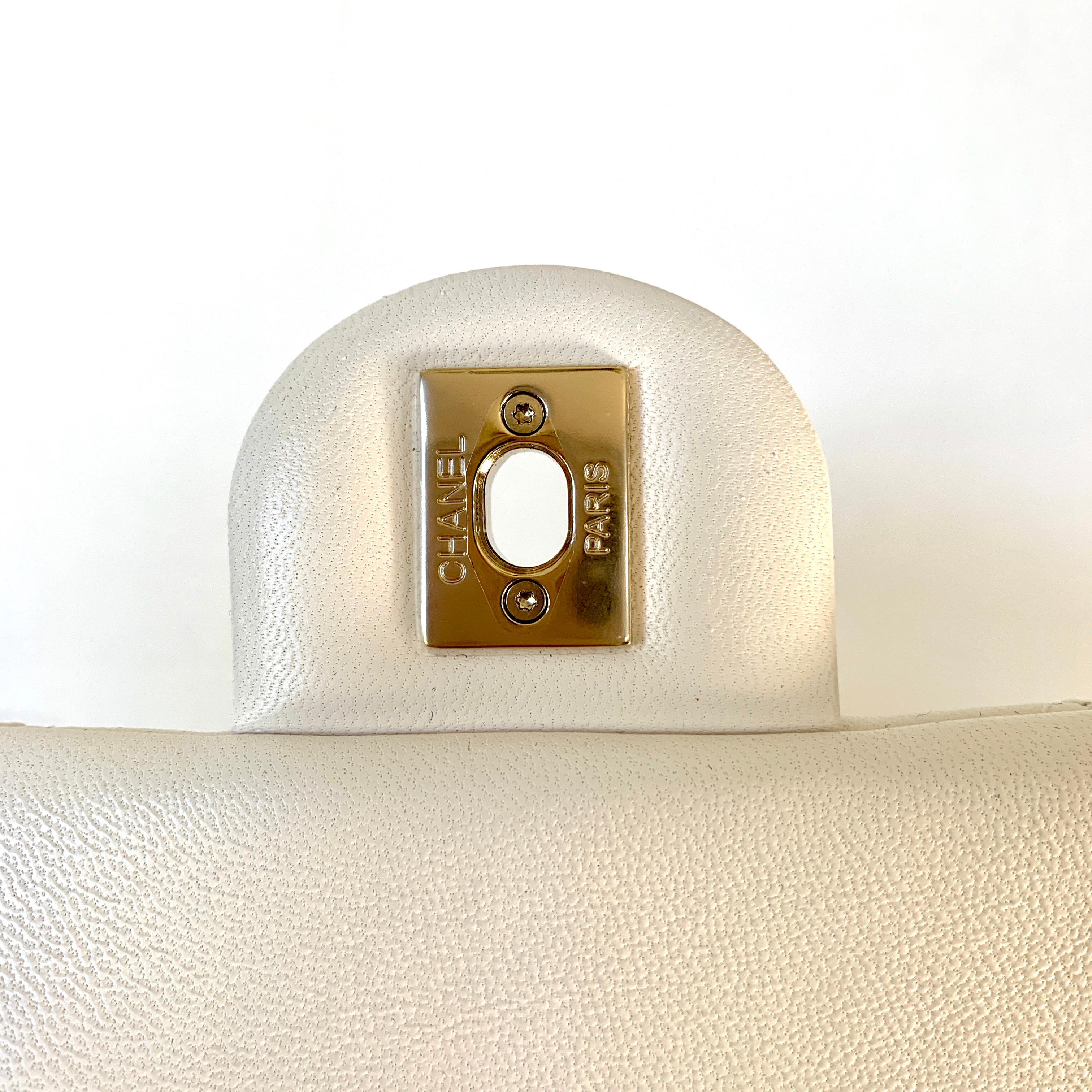 white bag with gold chain