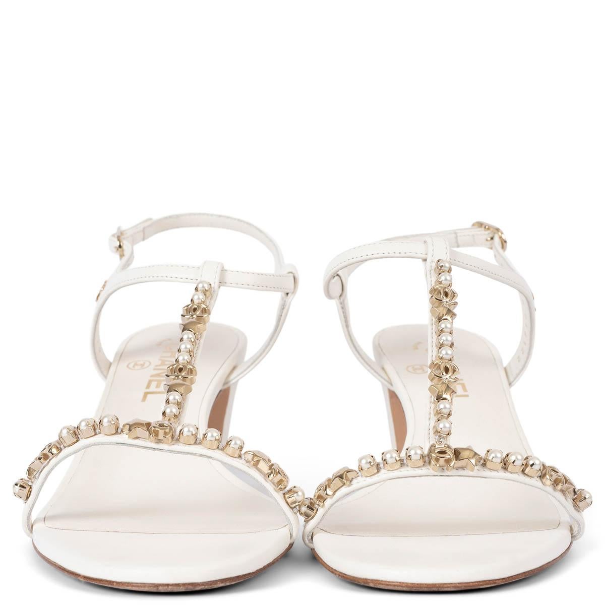 100% authentic Chanel t-strap sandals in off-white leather embellished with faux pearls, light gold-tone stars and CC logos. Have been worn and are in excellent condition. Come with dust bags. 

2020 Spring/Summer

Measurements
Model	20S G36122