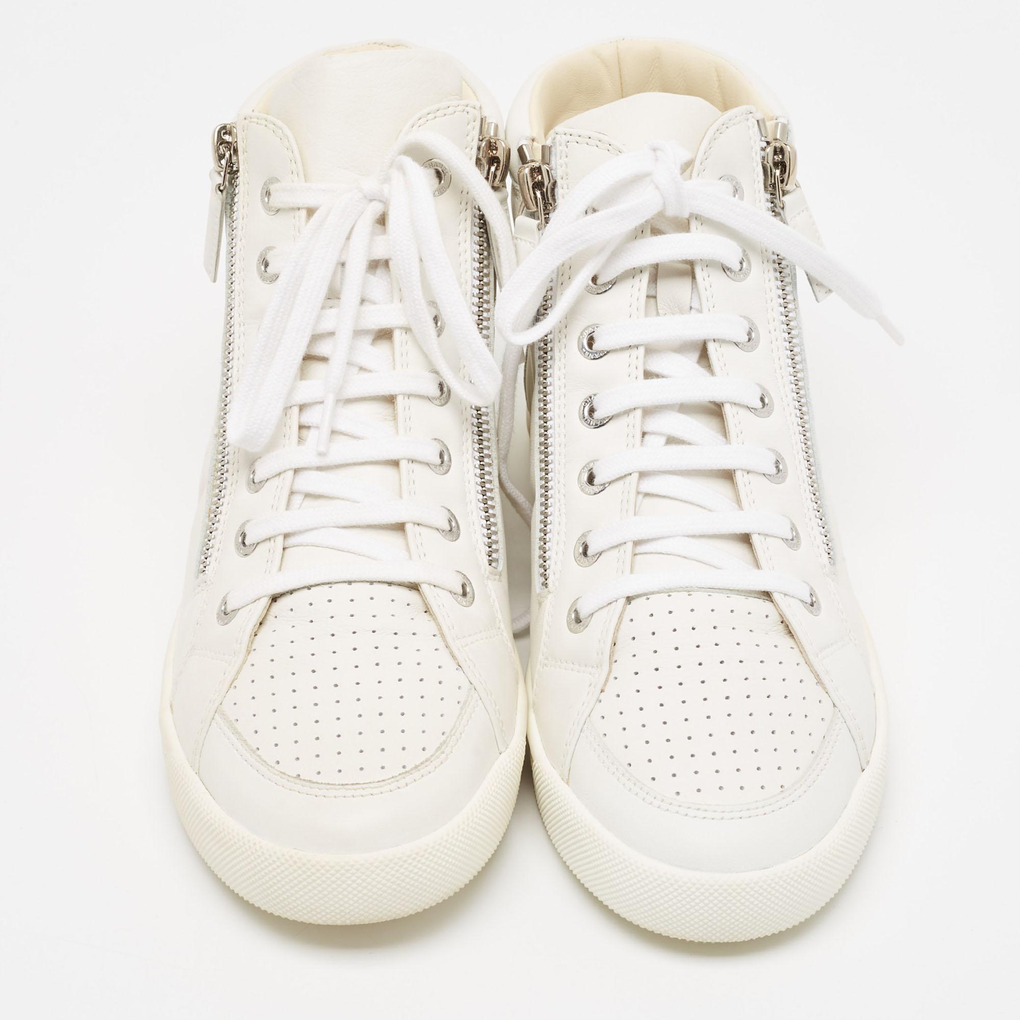 Step into fashion-forward luxury with these Chanel white sneakers. These premium kicks offer a harmonious blend of style and comfort, perfect for those who demand sophistication in every step.

Includes
Original Dustbag, Original Box, invoice