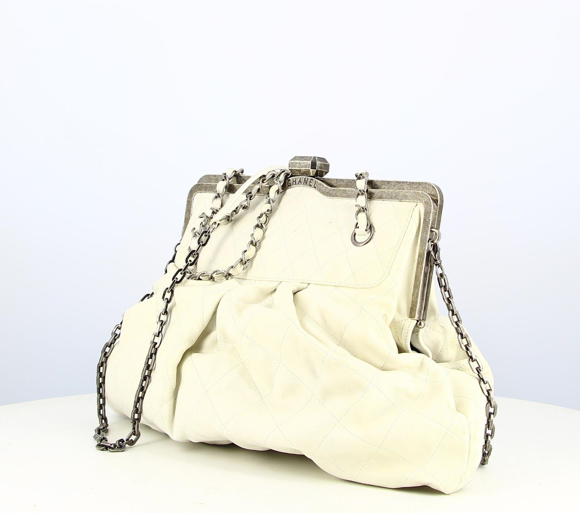Chanel White Leather Quilted Handbag
- Good condition, shows slight wear and tear with time
- Chanel clutch handbag, small silver chain strap + long crossbody strap, silver clasp
- The interior is in black fabric, small pocket inside zipped
- No