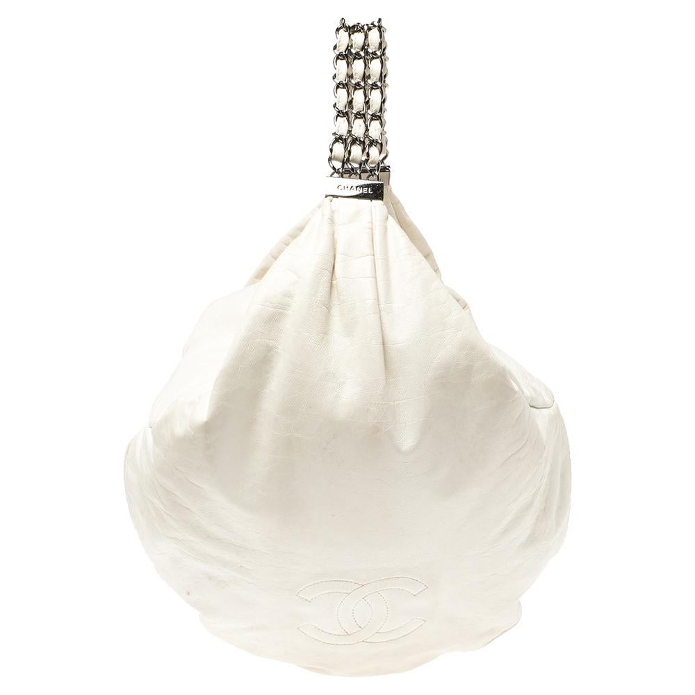 From the Spring/Summer 2007 collection, this Chanel Rock and Chain hobo is gorgeous. It is characterized by a spacious hobo silhouette and the bold interweaved handles. While the CC logo at the front adds a signature accent to this white leather