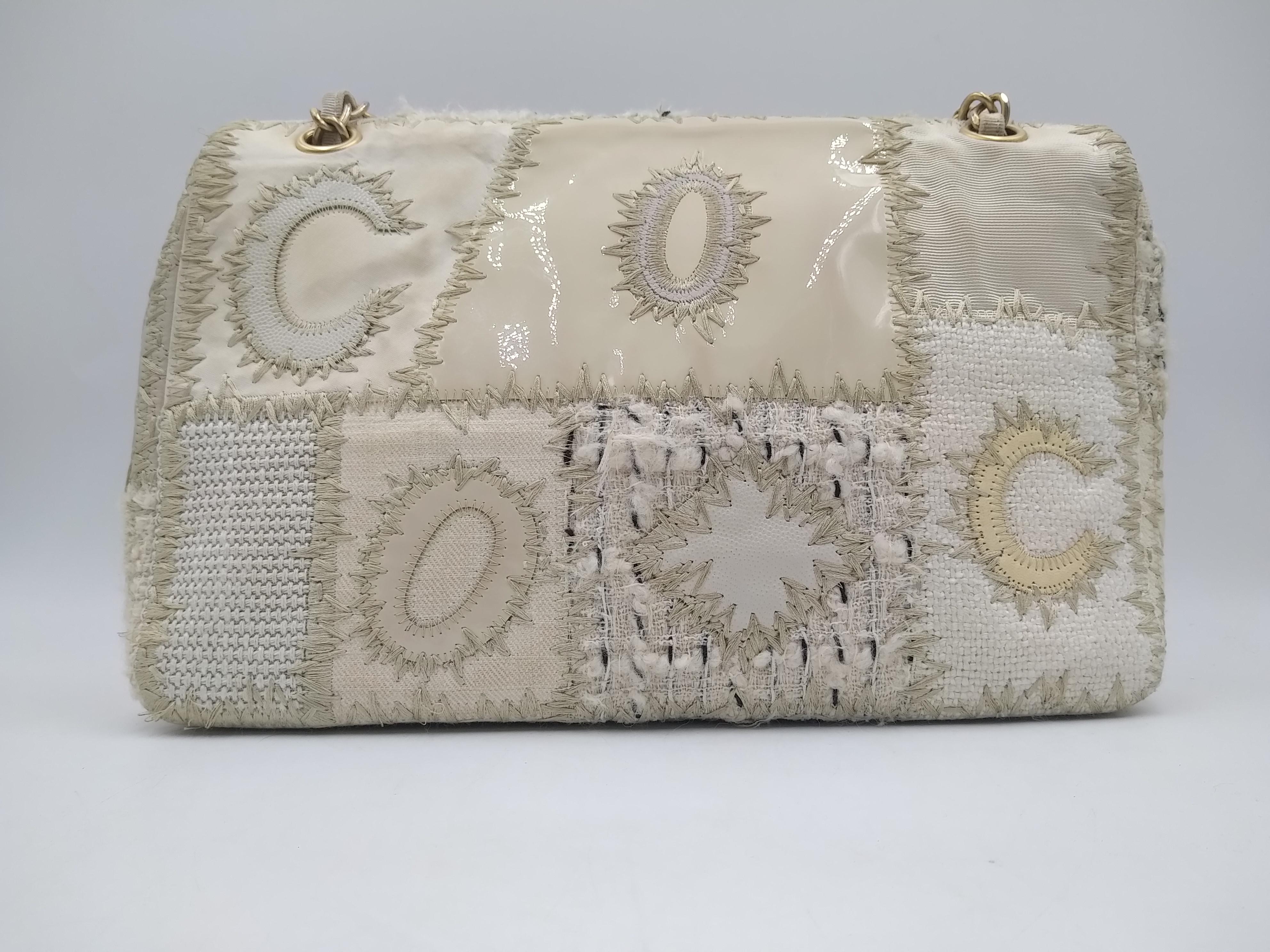 Chanel White Medium Tweed Flap Bag, 2018.
-100% authentic Chanel
-tweed and canvas, leather trim
- woven chain shoulder strap
- front flap with CC twist closure
- interior zip
- interior slide pockets
- Booklet, authenticity card, dustbag and box