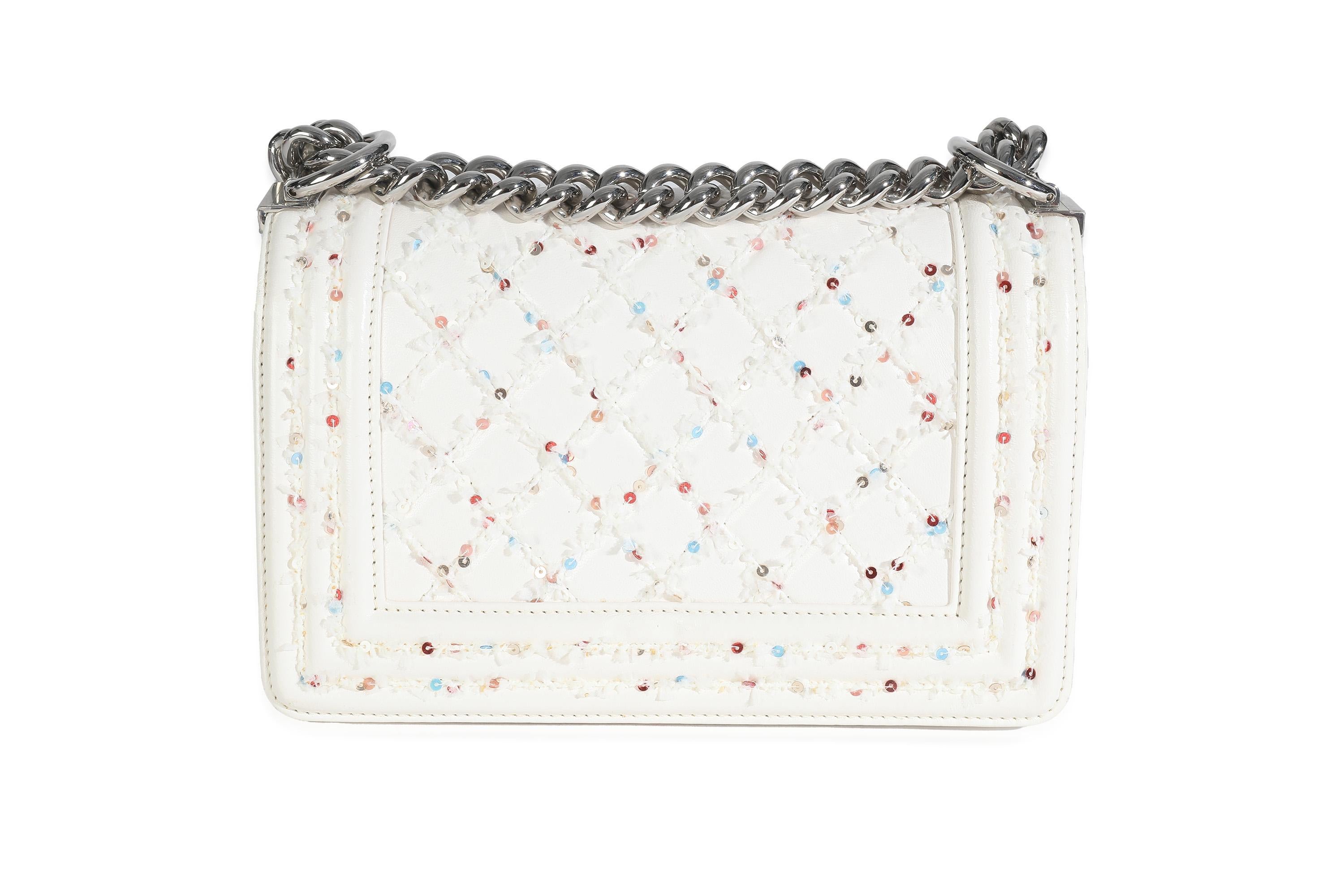 Listing Title: Chanel White Multicolor Lambskin Sequin Embroidered Small Boy Bag
SKU: 148320
MSRP: 6700.00 USD
Condition: Pre-owned 
Condition Description: An instant classic, the Boy bag from Chanel was introduced in 2011. The quilted bag was