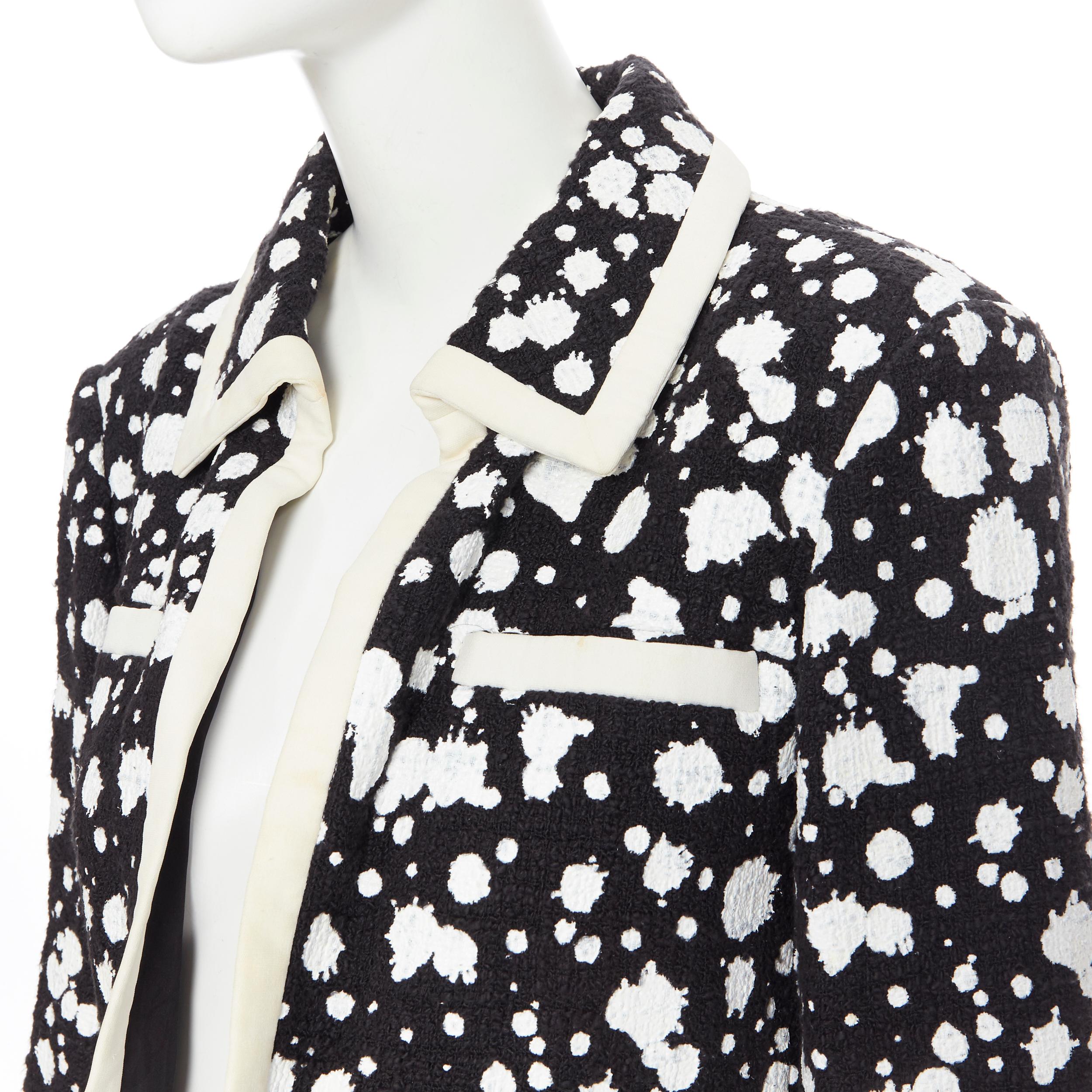 CHANEL white paint splatter black tweed cotton trimmed 4-pocket crop jacket FR40
Brand: Chanel
Designer: Karl Lagerfeld
Model Name / Style: Tweed jacket
Material: Cotton, rayon
Color: Black, white
Pattern: Abstract; paint splatter
Extra Detail: Open