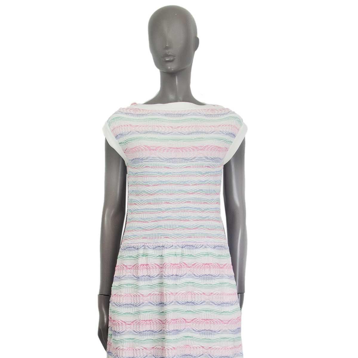 100% authentic Chanel 2016 Paris - Seoul sleeveless boat neck knit dress in off-white, pale pink, pale blue and pale green cotton (93%) and nylon (7%). Decorative buttons on the shoulder and slit pockets on the side. Has been worn and is in