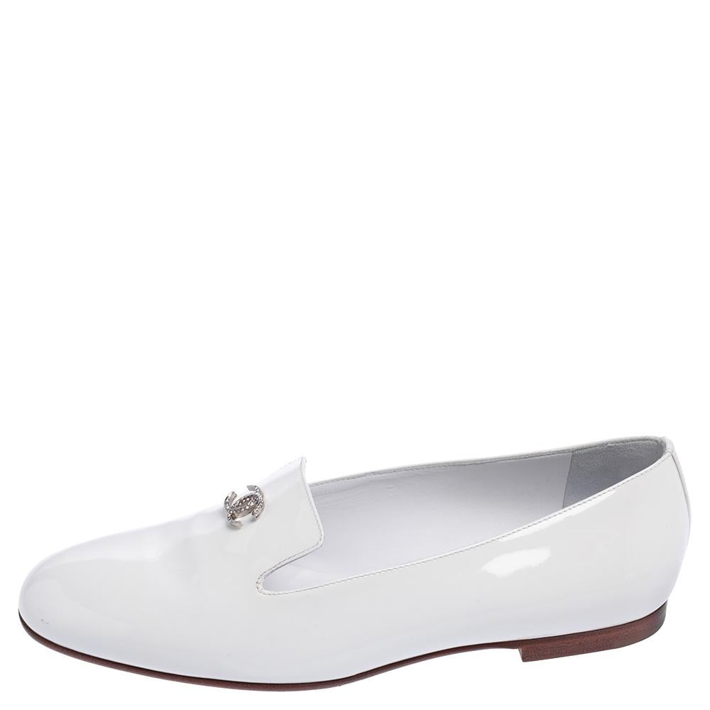Ring in comfort and style together with these white-hued patent leather Chanel Smoking Slippers. They feature the interlocking CC on the uppers for a look of luxury and have an easy fit. Leather insoles complete this lovely pair.

Includes: Original