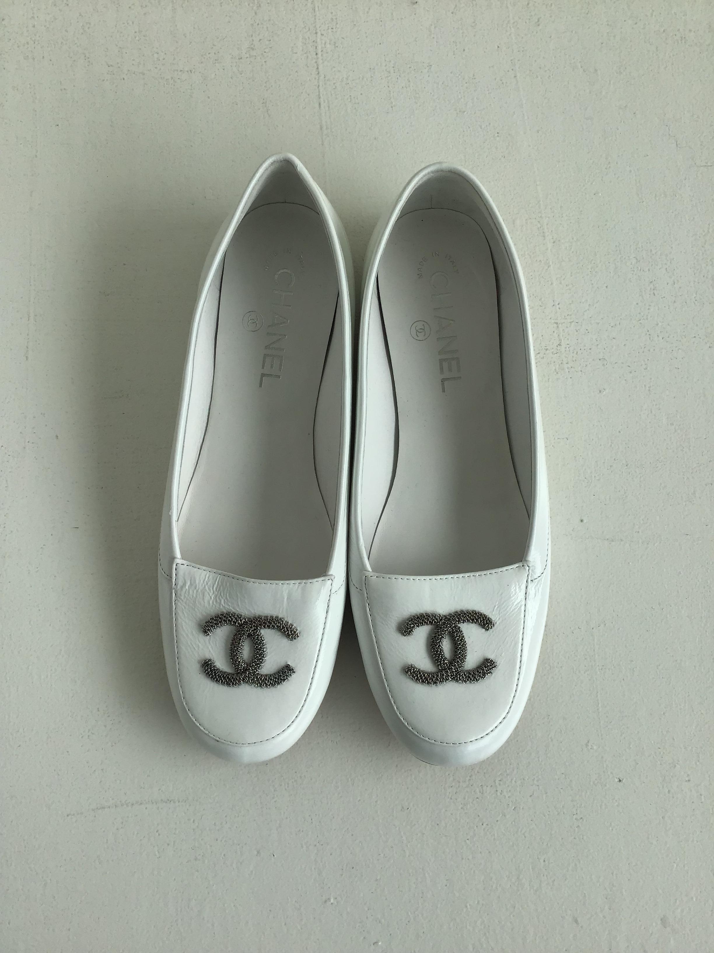 Chanel White Patent Leather Loafers, size 7.5

Description:
Material: White Patent Leather
Design: Silver metal CC Logo on toe box
*Slight discoloration on the left side of the left shoe, please see last image.