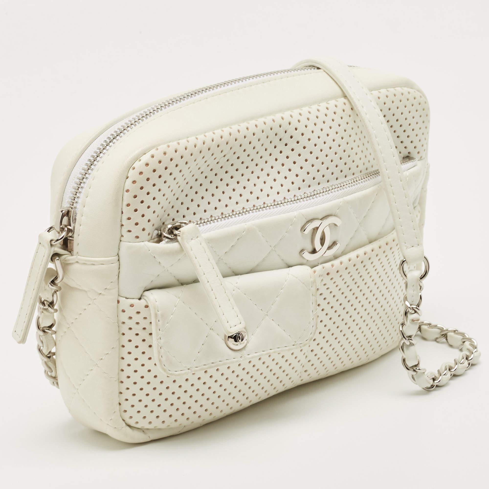 Indulge in luxury with this Chanel Ultra Pocket Camera bag. Meticulously crafted from premium materials, it combines exquisite design, impeccable craftsmanship, and timeless elegance. Elevate your style with this fashion accessory.

