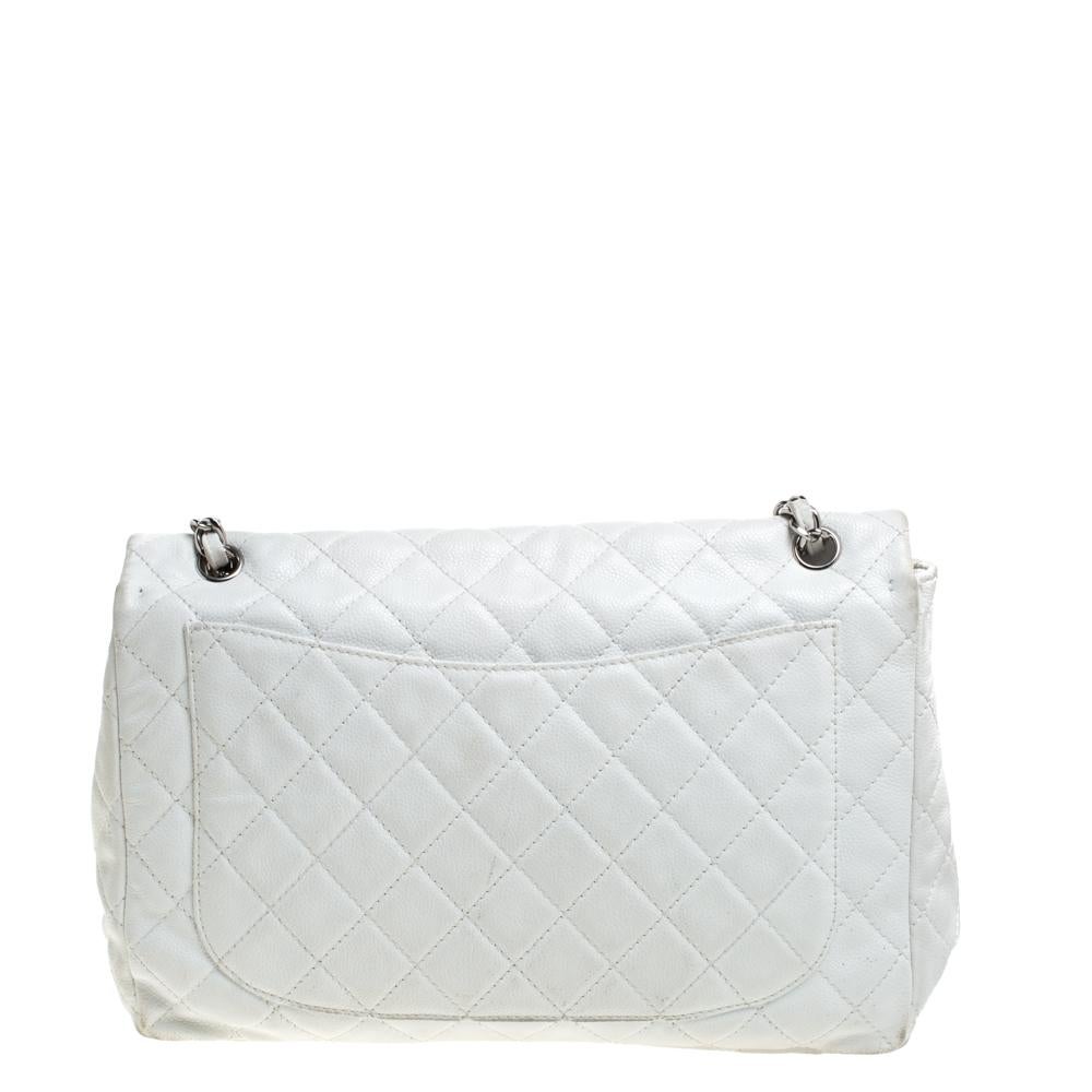 We are in utter awe of this flap bag from Chanel as it is appealing in a surreal way. Exquisitely crafted from leather in a quilt design, it has a leather and canvas interior and the iconic CC turn-lock on the flap. The piece has silver-tone