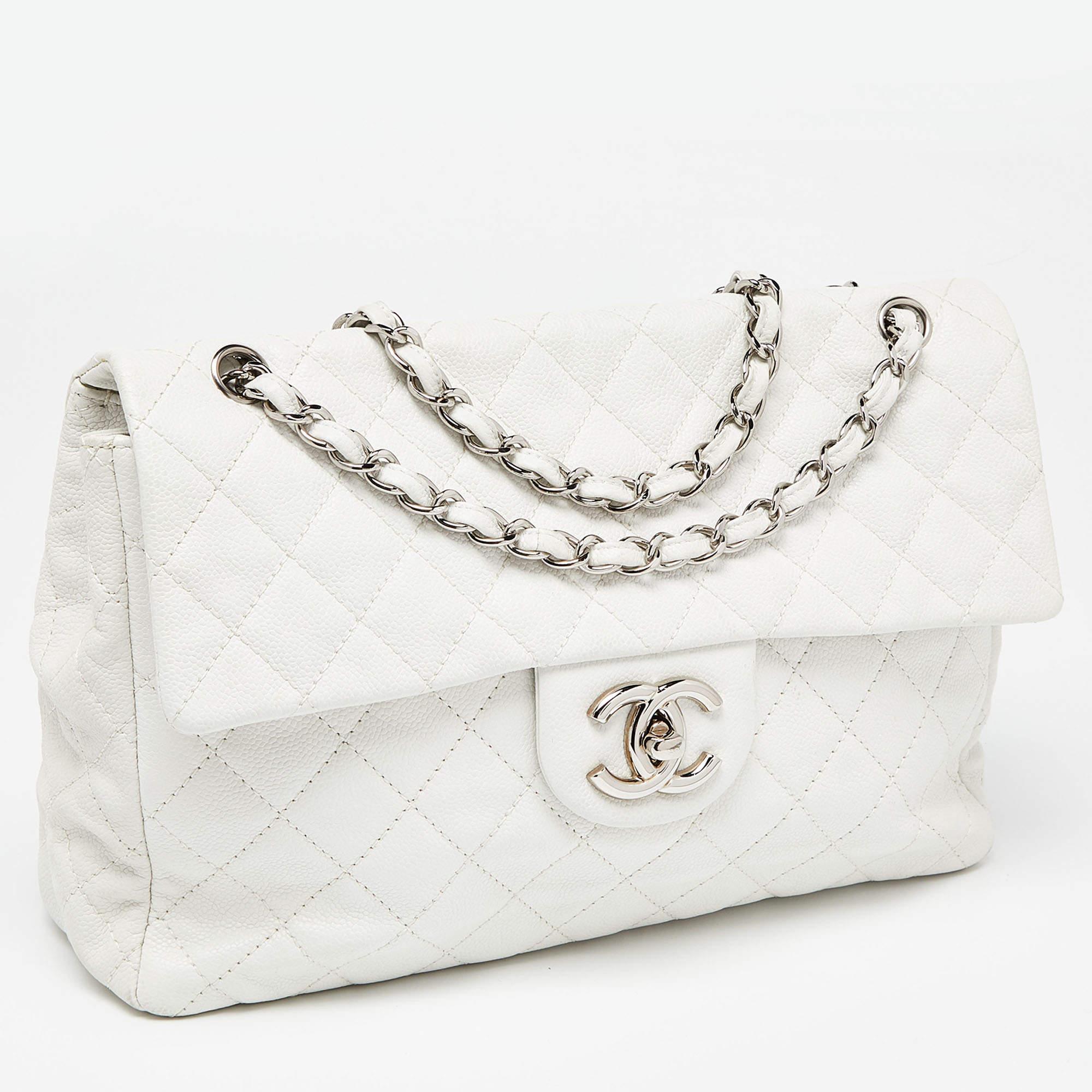 Elevate your style with this Chanel white bag. Merging form and function, this exquisite accessory epitomizes sophistication, ensuring you stand out with elegance and practicality by your side.

