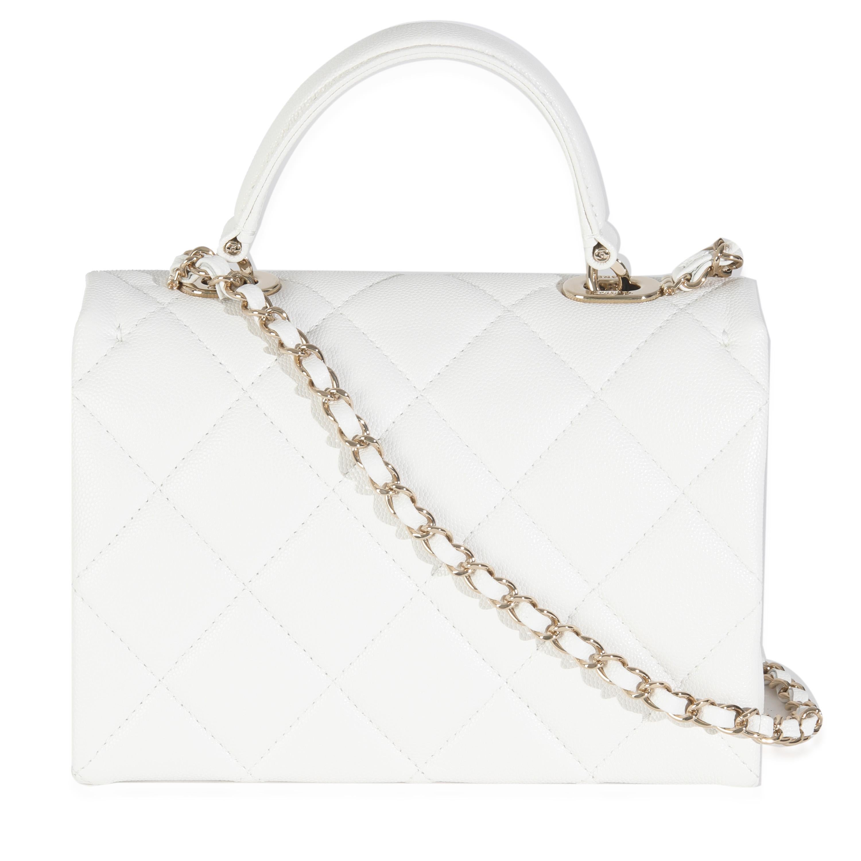 Listing Title: Chanel White Quilted Caviar Retro Twist Mini Flap Bag
SKU: 146031
Condition: Pre-owned 
Condition Description: A timeless classic that never goes out of style, the flap bag from Chanel dates back to 1955 and has seen a number of