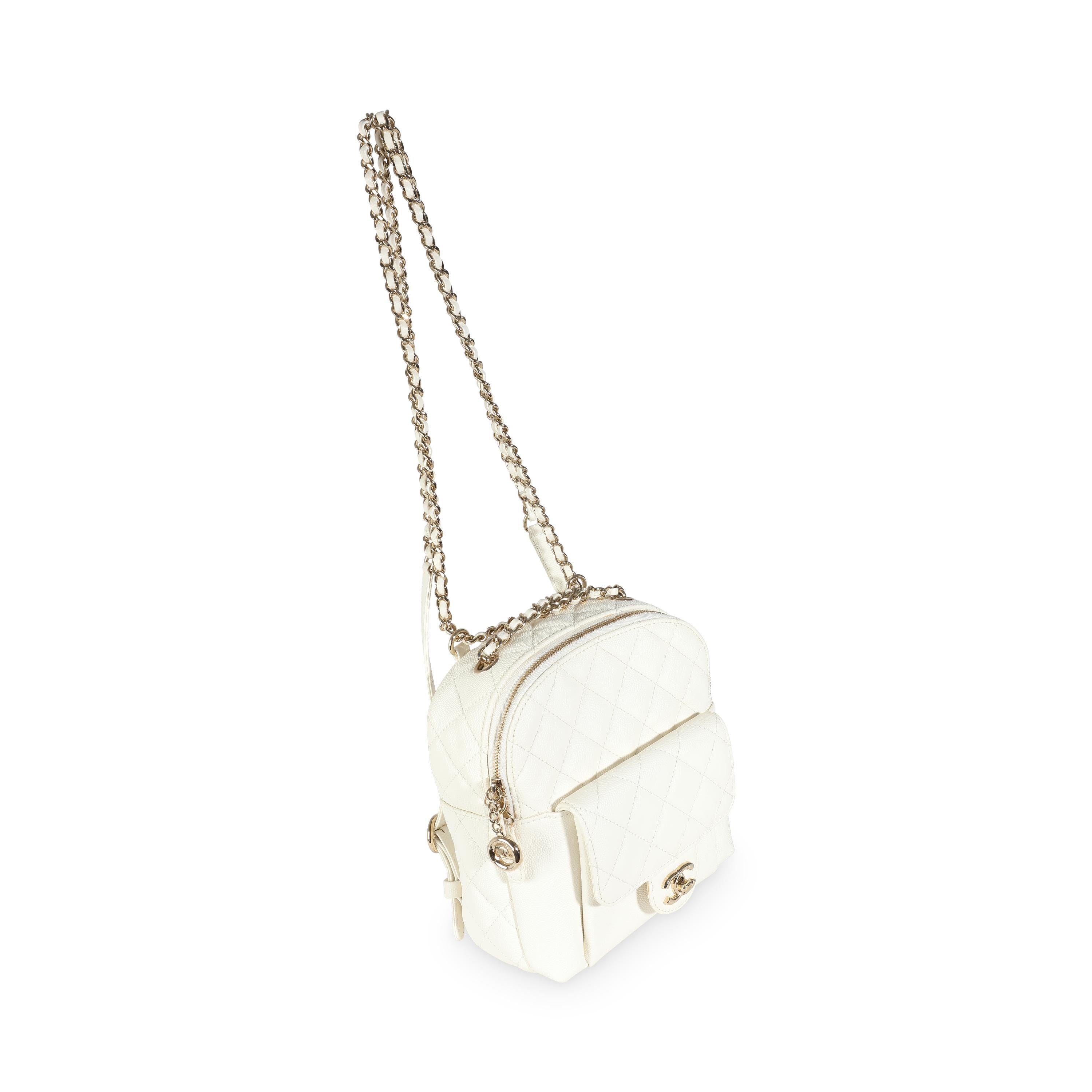 Listing Title: Chanel White Quilted Caviar Small CC Day Backpack
SKU: 141334
Condition: Pre-owned 
Handbag Condition: Excellent
Condition Comments: Item is in excellent condition and displays light signs of wear. Hairline scratching along