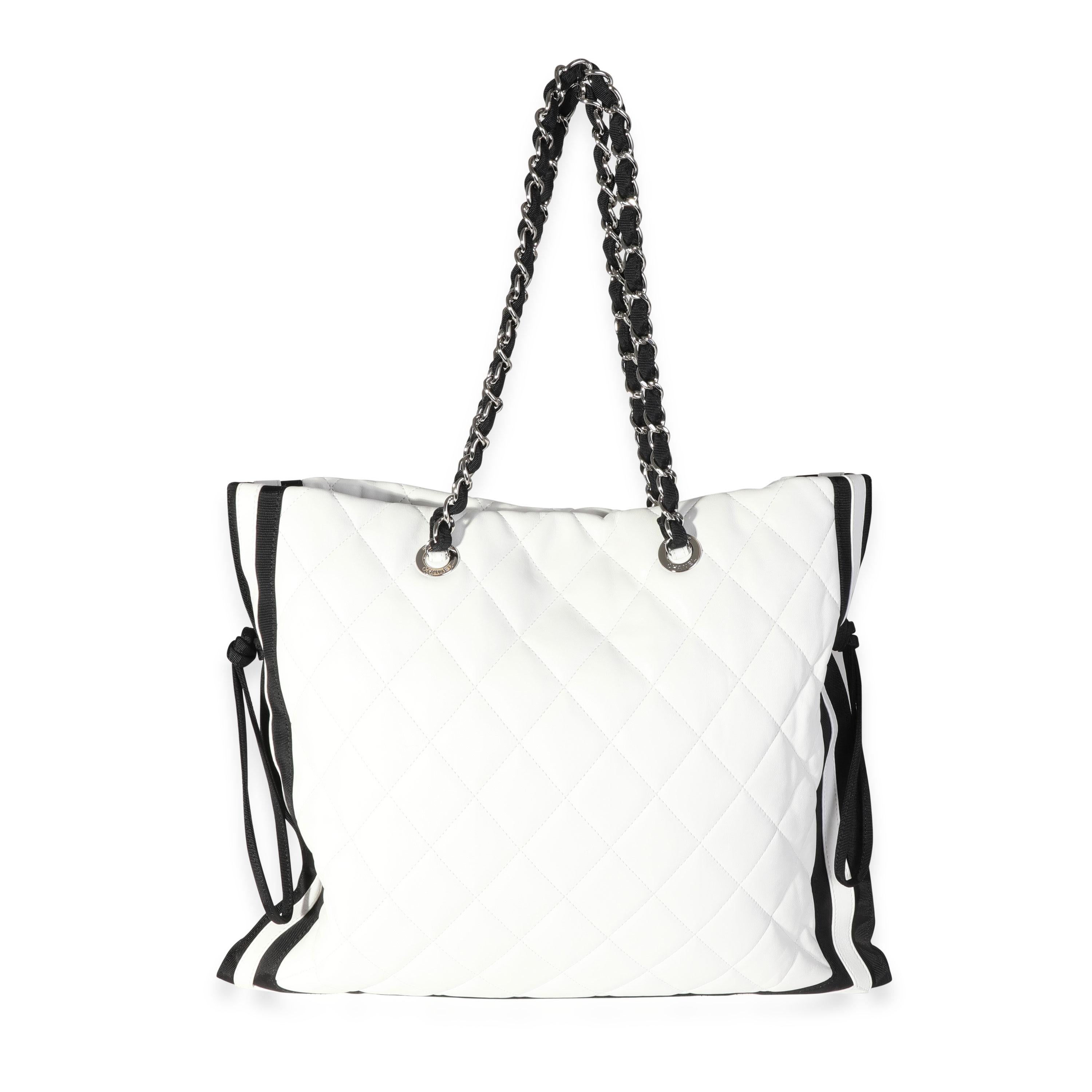 Listing Title: Chanel White Quilted Lambskin & Black Grosgrain CC Drawstring Tote
SKU: 118163
Condition: Pre-owned (3000)
Handbag Condition: Very Good
Condition Comments: Very Good Condition. Light marks throughout leather.
Brand: Chanel
Origin