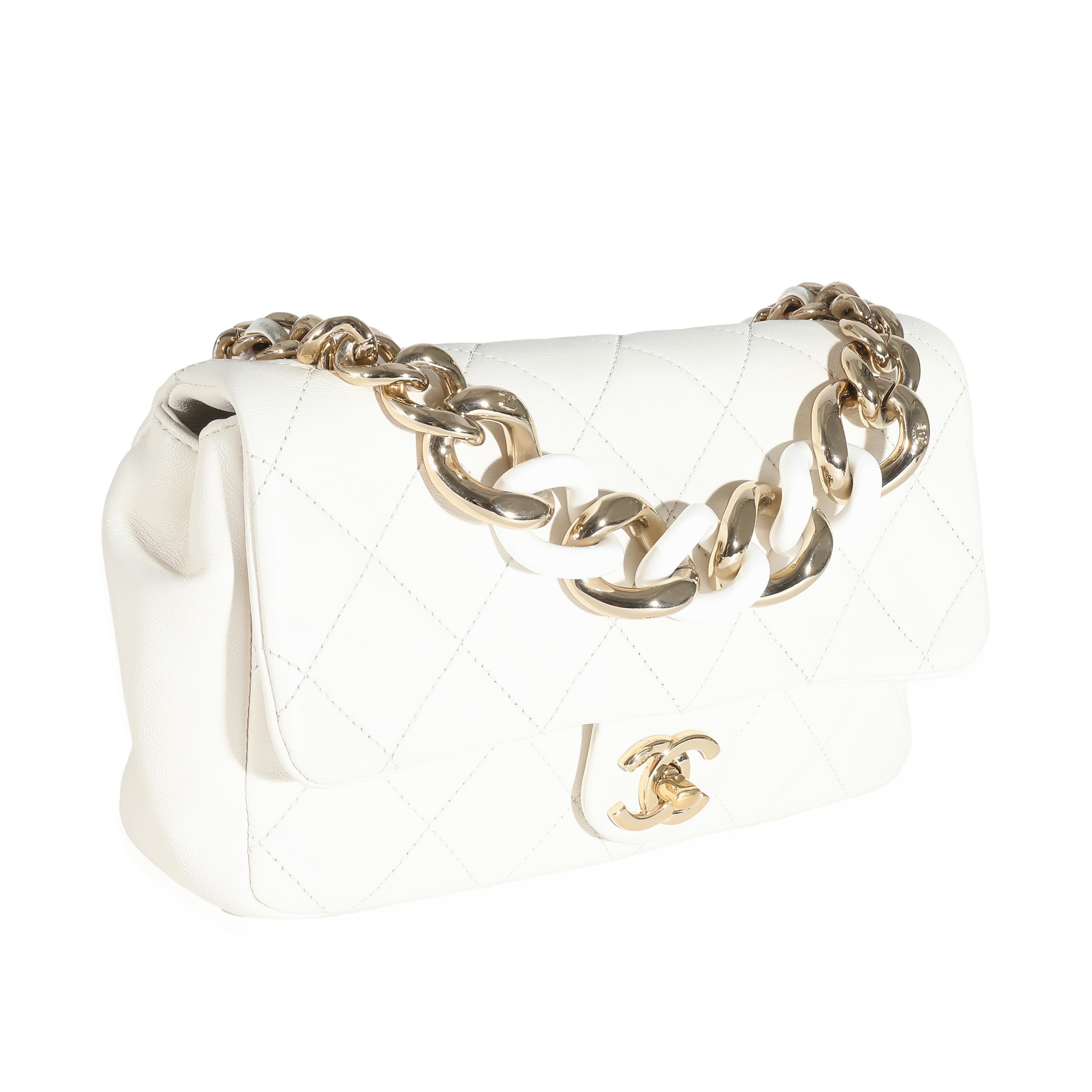 Listing Title: Chanel White Quilted Lambskin Elegant Chain Flap Bag
SKU: 136123
Condition: Pre-owned 
Condition Description: A timeless classic that never goes out of style, the flap bag from Chanel dates back to 1955 and has seen a number of