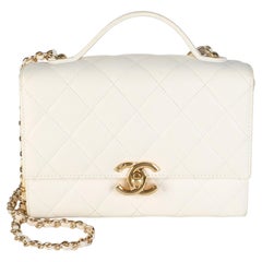 Chanel Mini-Clutch aus weißem, gestepptem Lammleder mit goldener Plakette